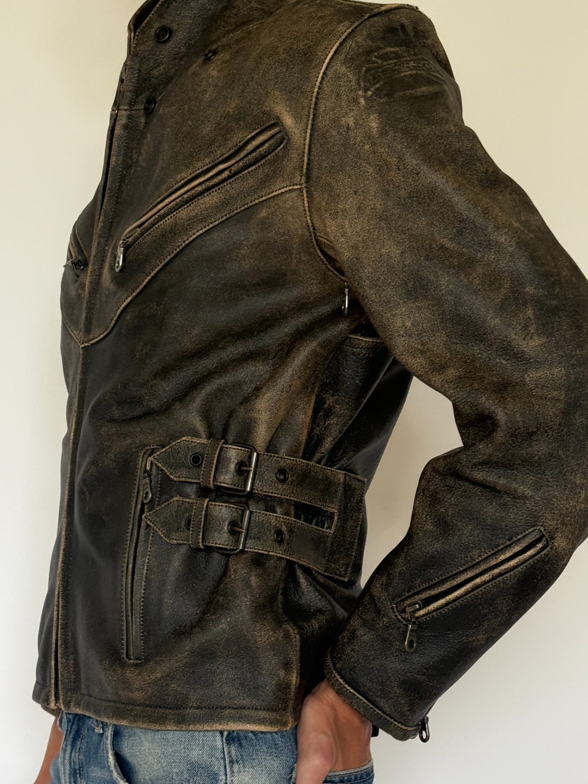 Vintage distressed leather moto jacket leather close-up