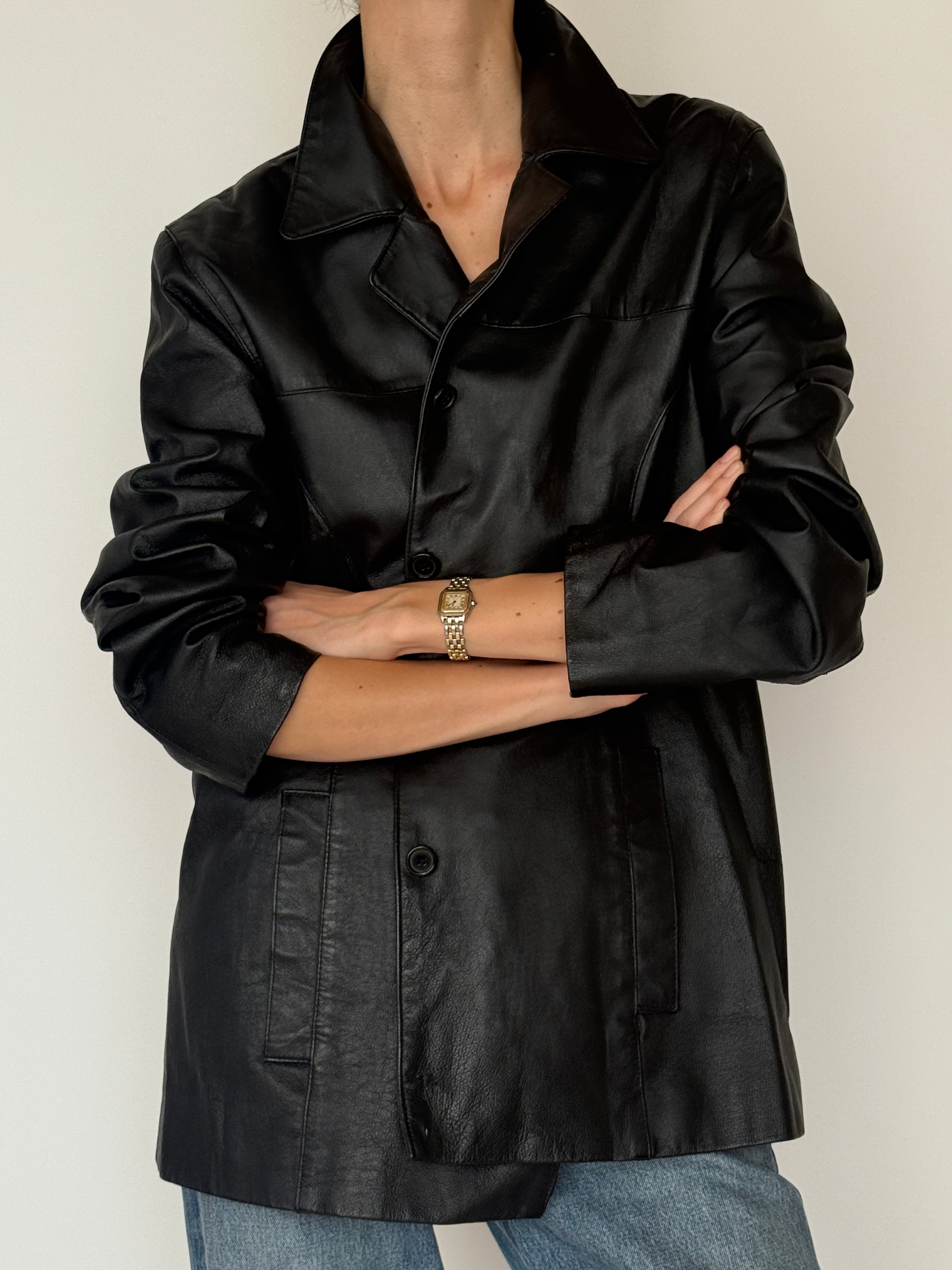 Vintage black leather jacket collar close-up notch lapel detail