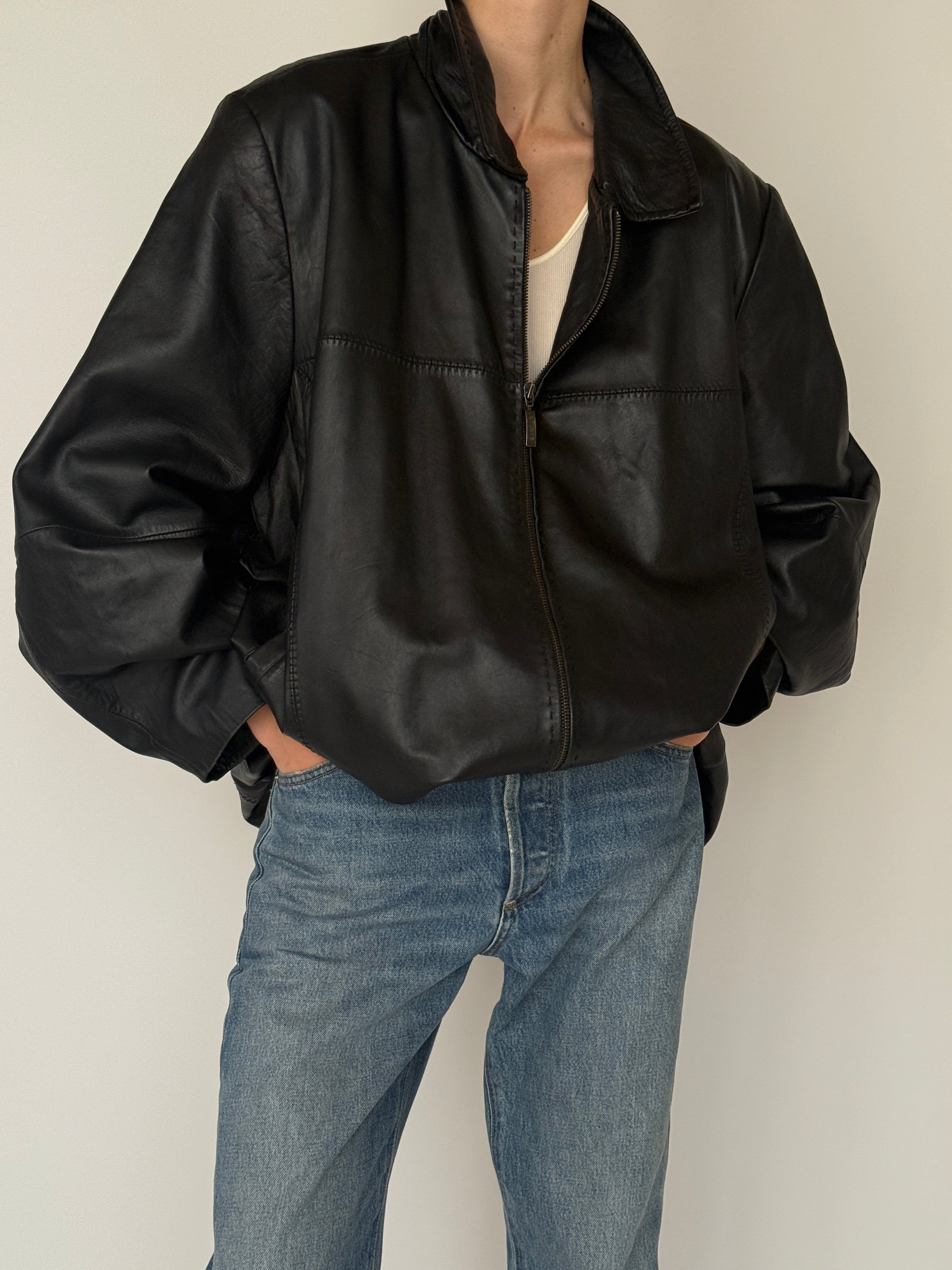 Vintage black leather jacket collar detail