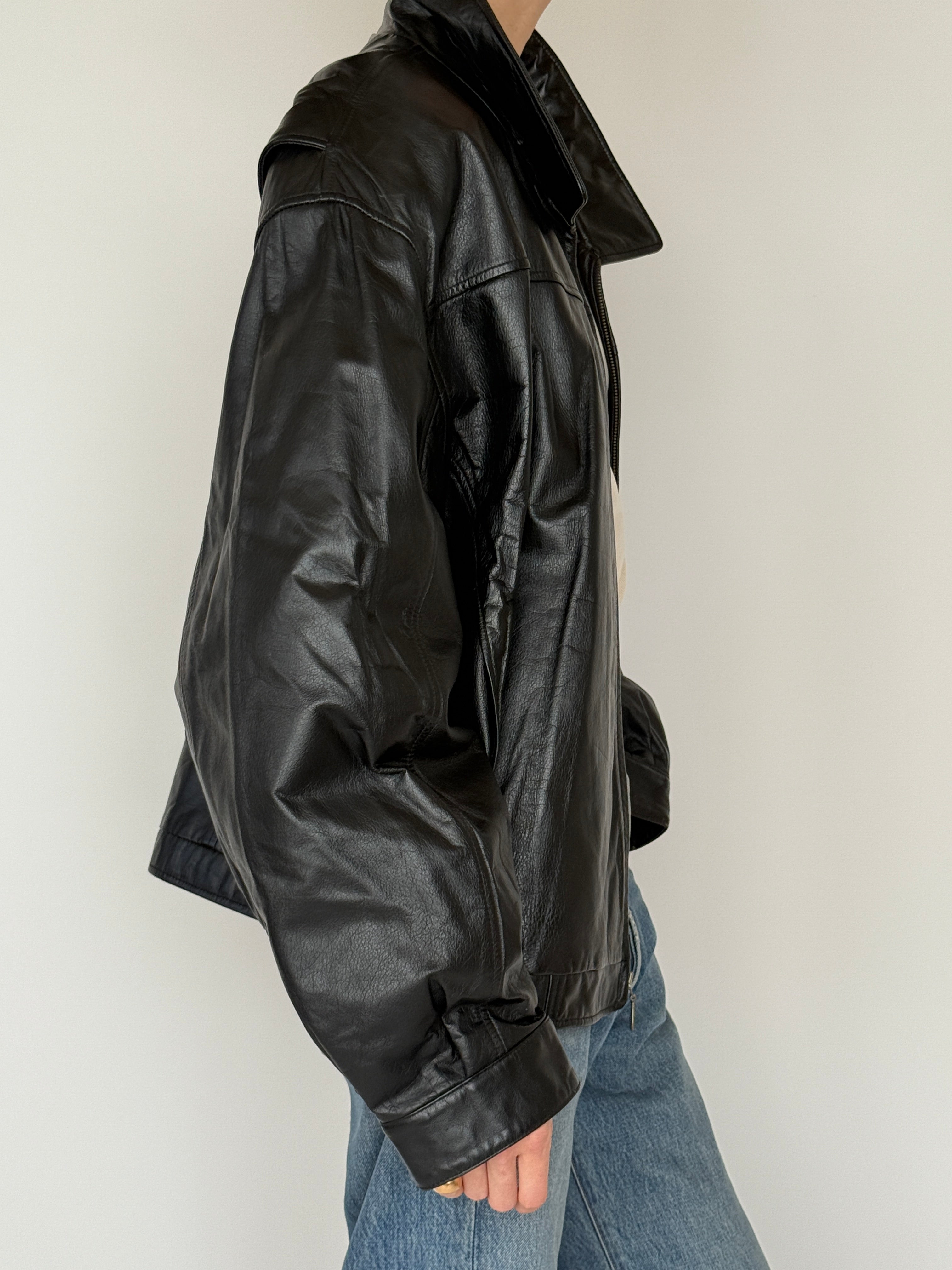 Vintage black leather jacket side view