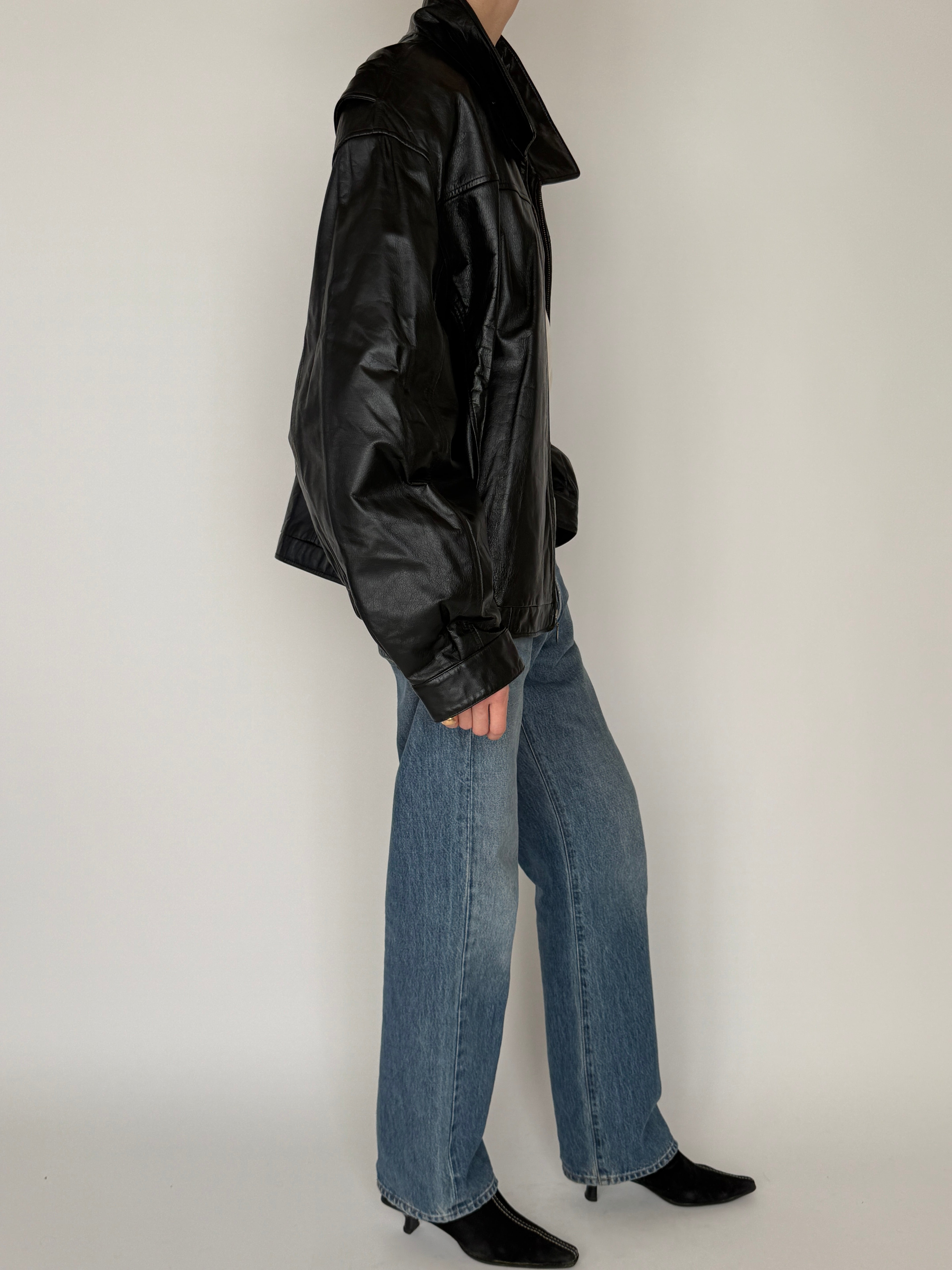 Vintage black leather jacket side view