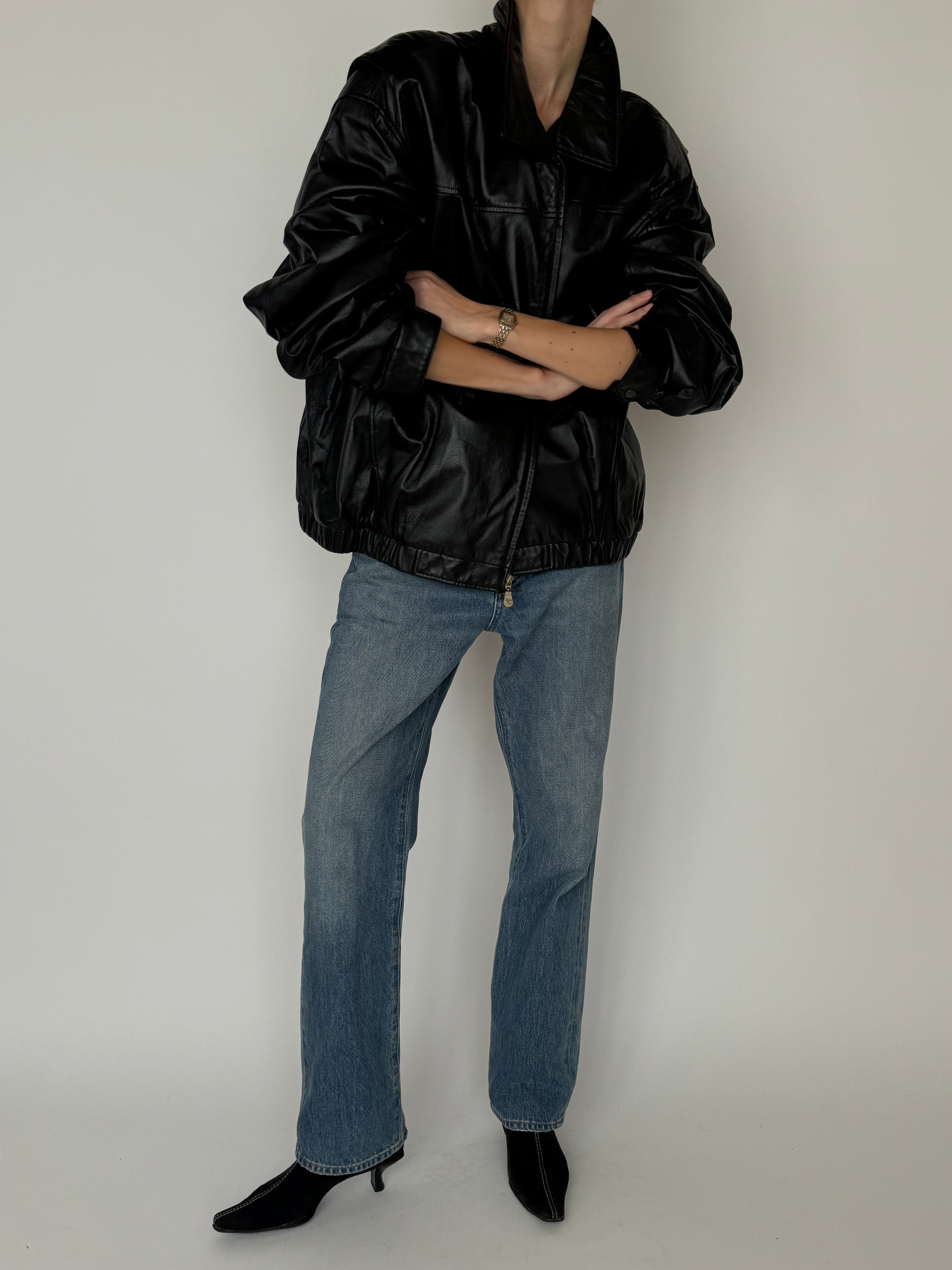 Vintage black leather jacket zipper detail