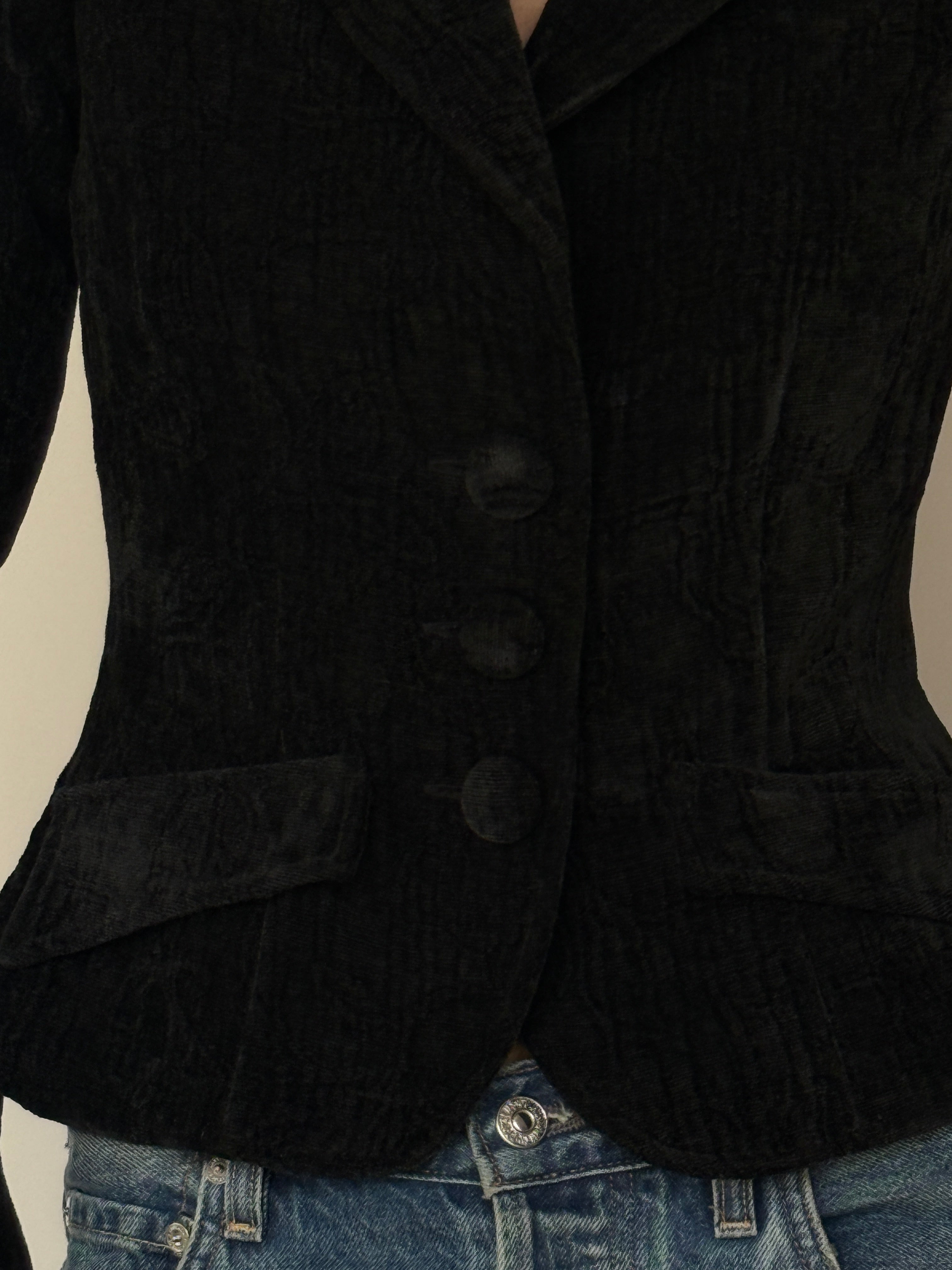 Vintage black velvet fitted blazer fabric texture close-up
