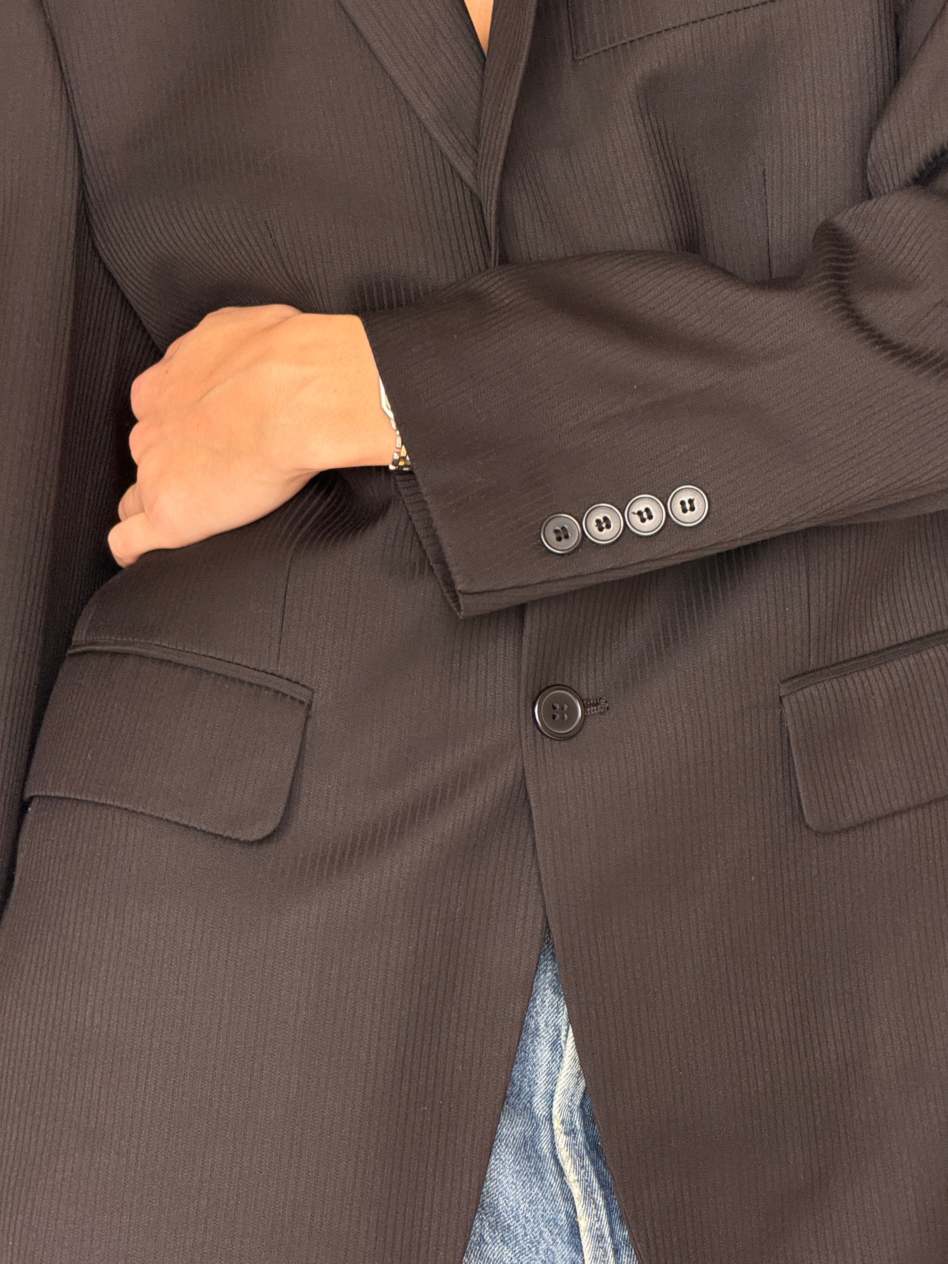 Vintage black blazer fabric texture close-up