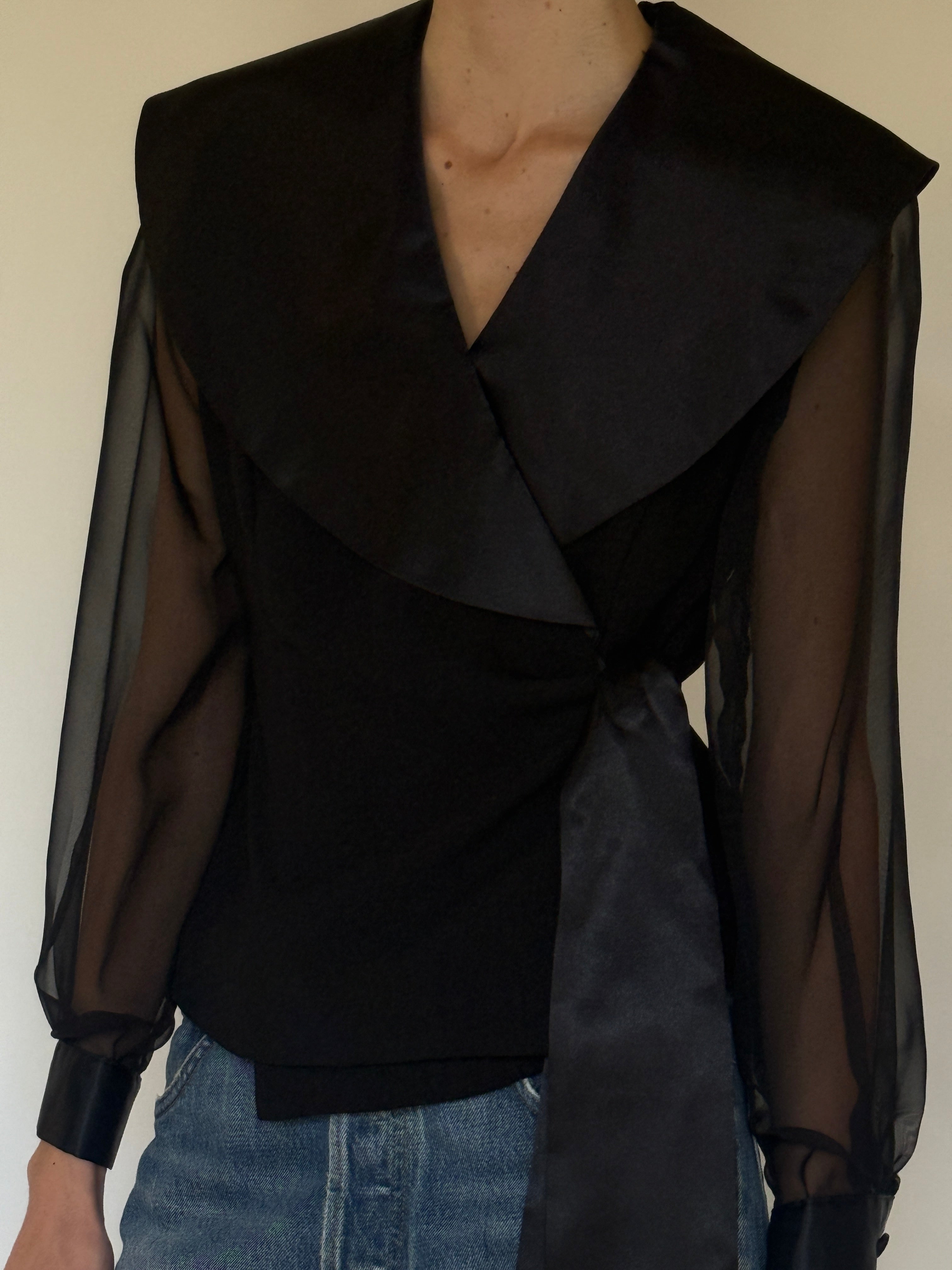 Vintage black wrap blouse close-up of oversized satin shawl collar