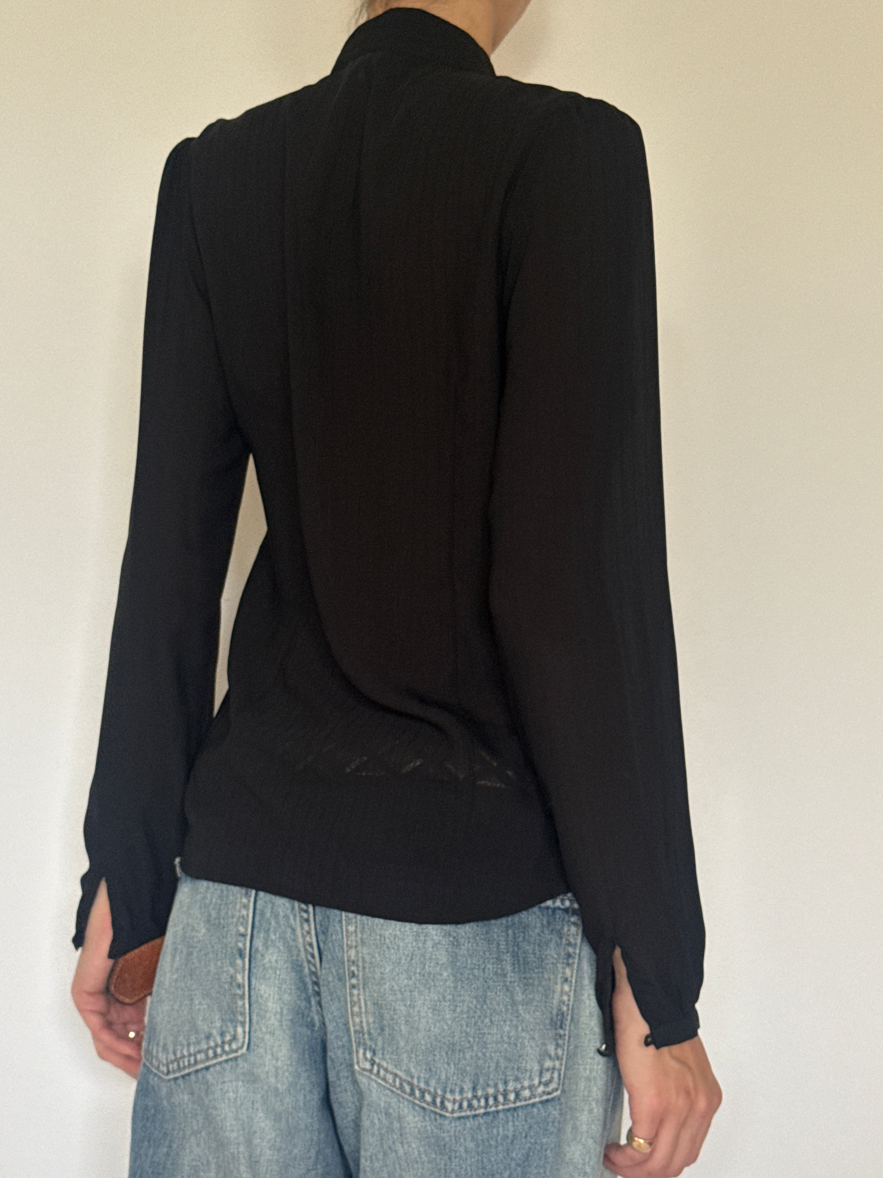 Vintage lightweight black ruffle blouse back view