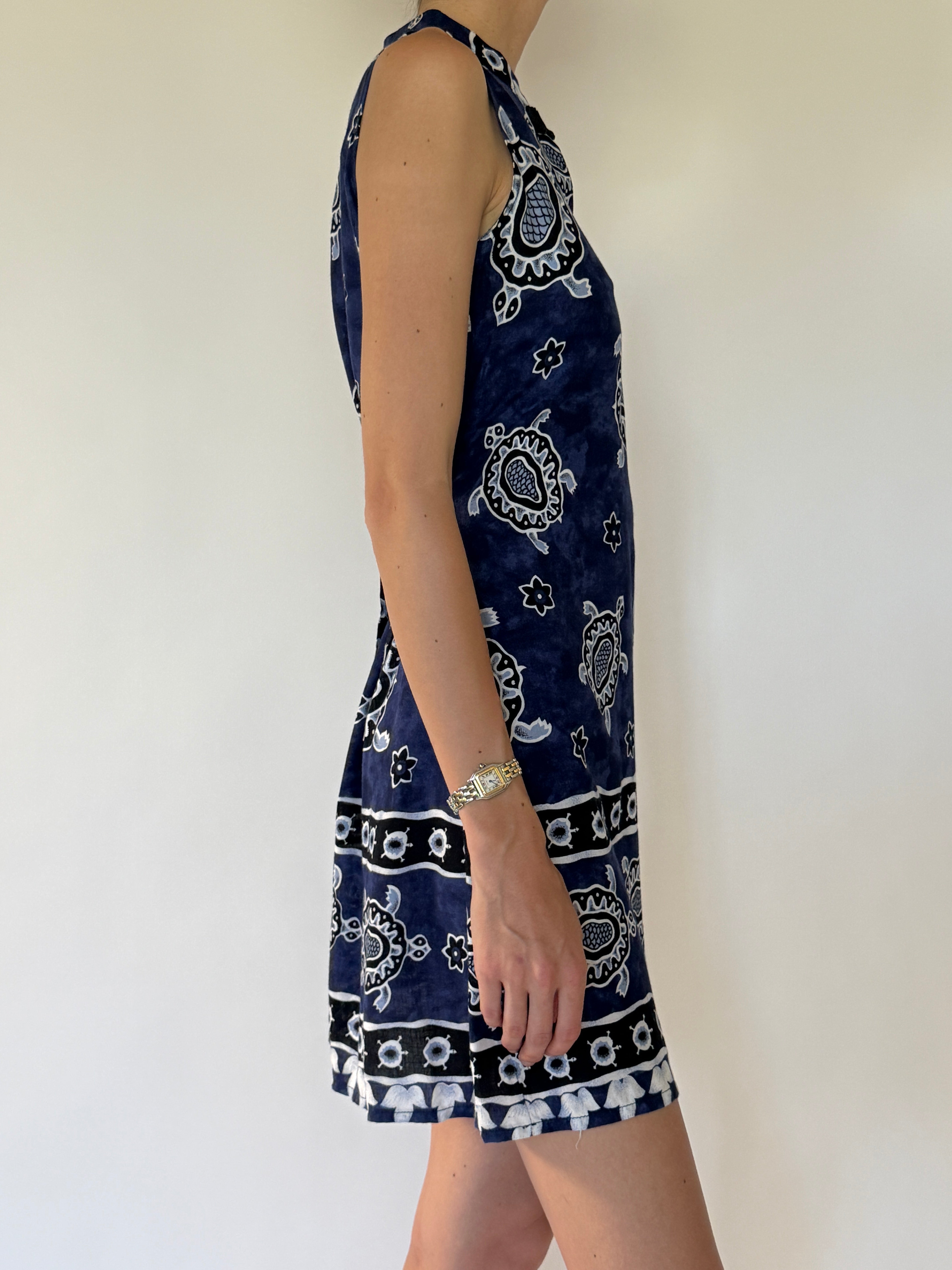 Vintage navy blue turtle-print mini dress angled view