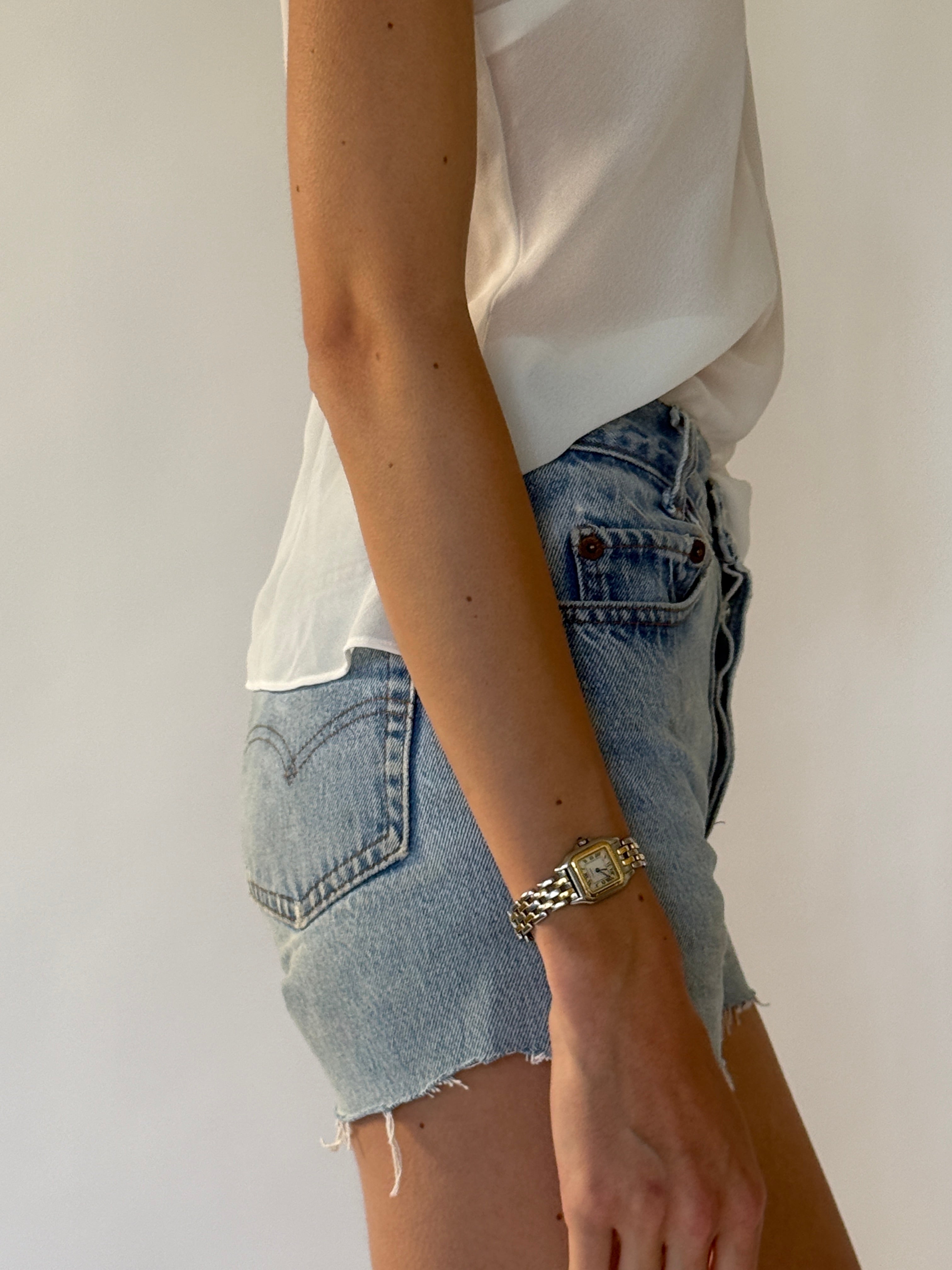 Vintage Levi's light blue denim shorts side view