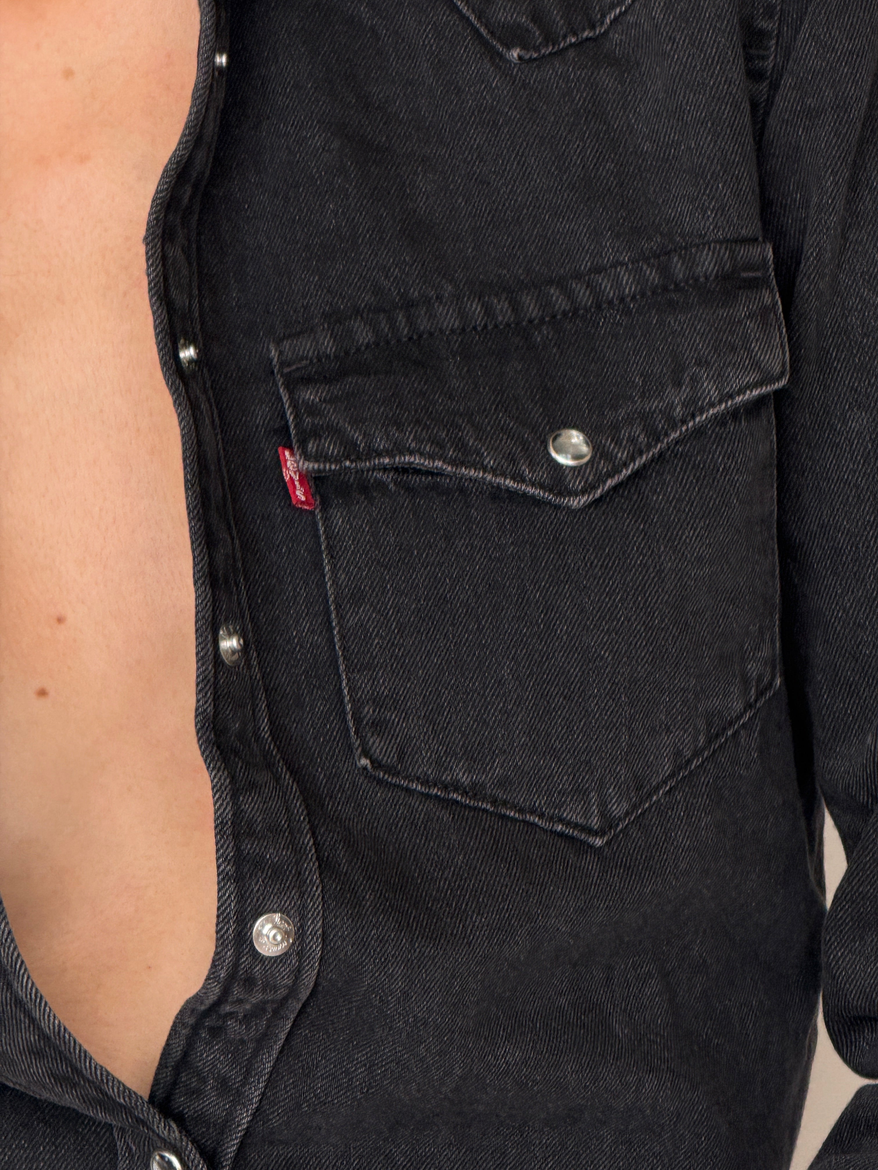 Vintage Levi’s faded black denim shirt chest pocket detail