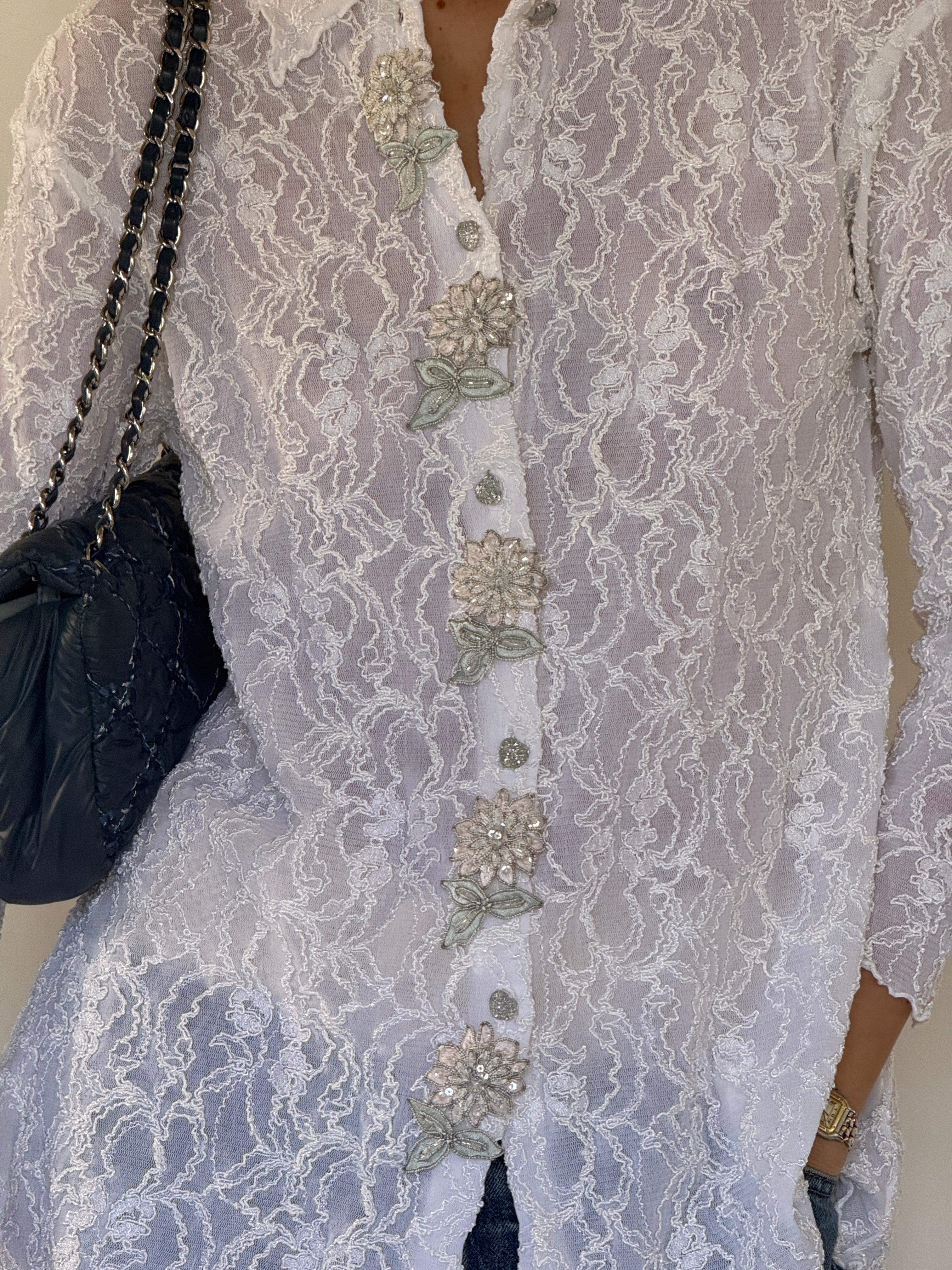 Vintage lace blouse button and appliqué detail