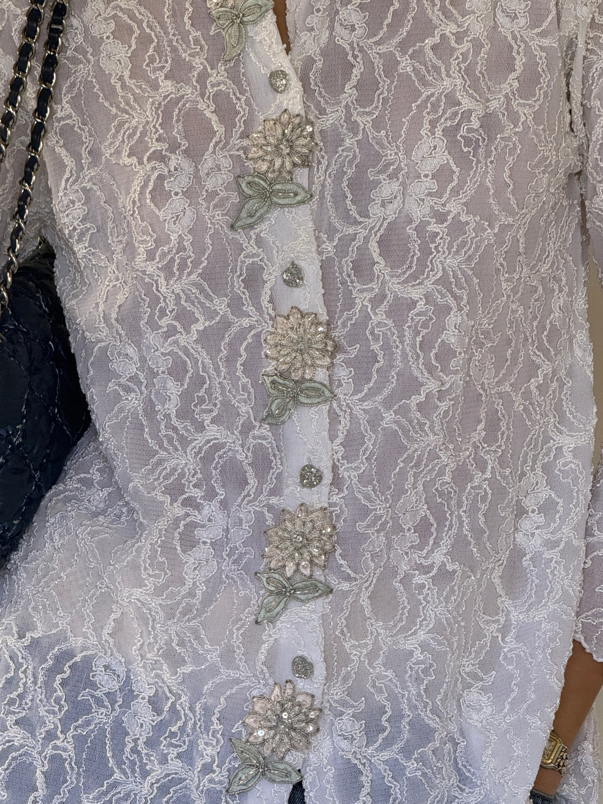 Vintage lace blouse button and appliqué detail