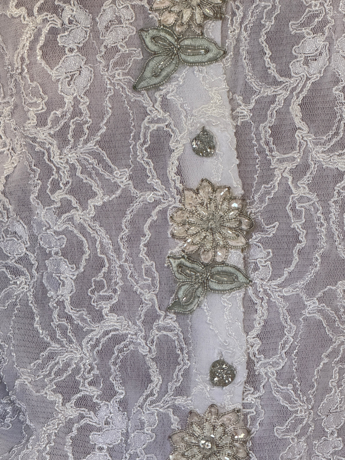 Vintage lace blouse front detail with floral buttons