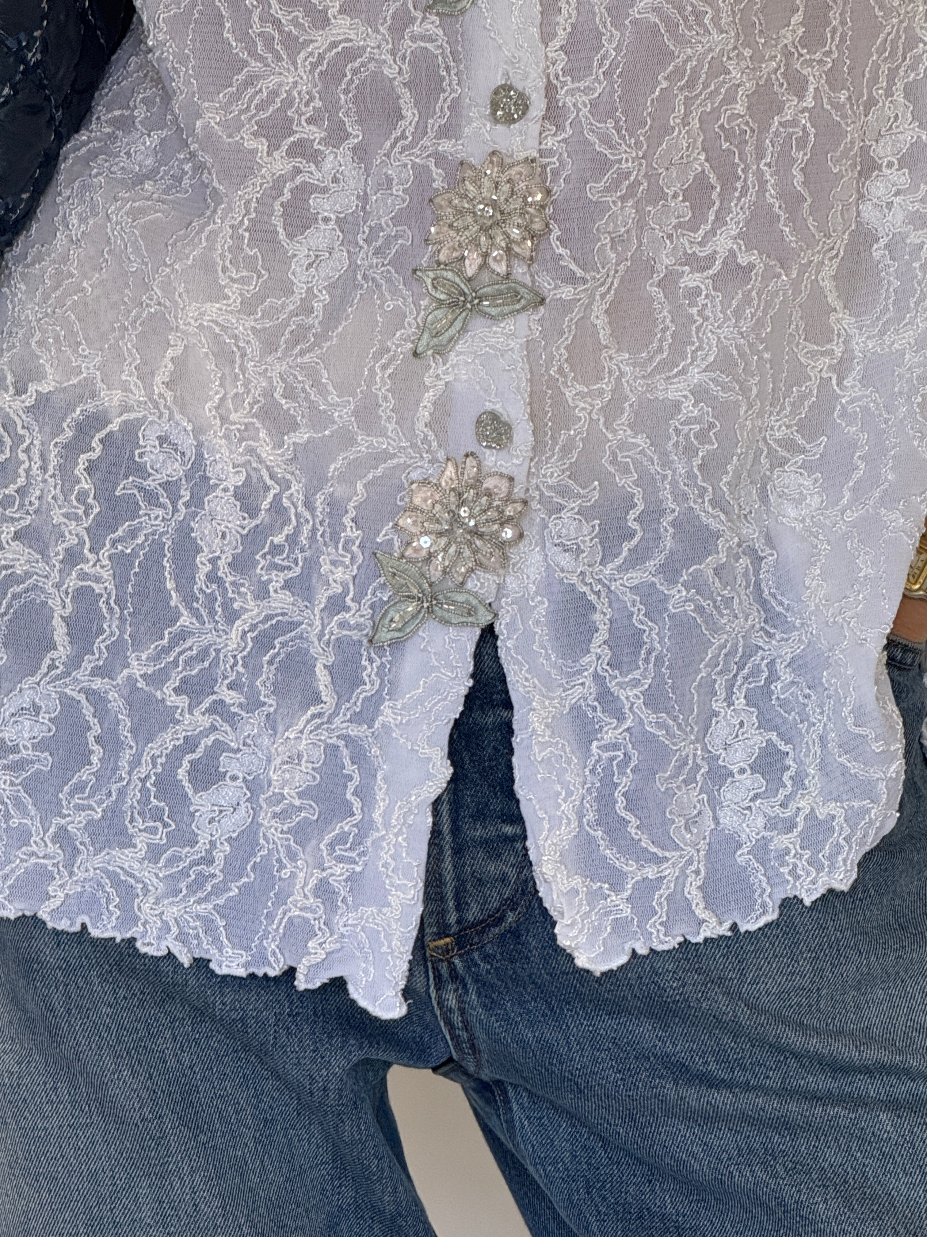 Vintage lace blouse button and appliqué detail