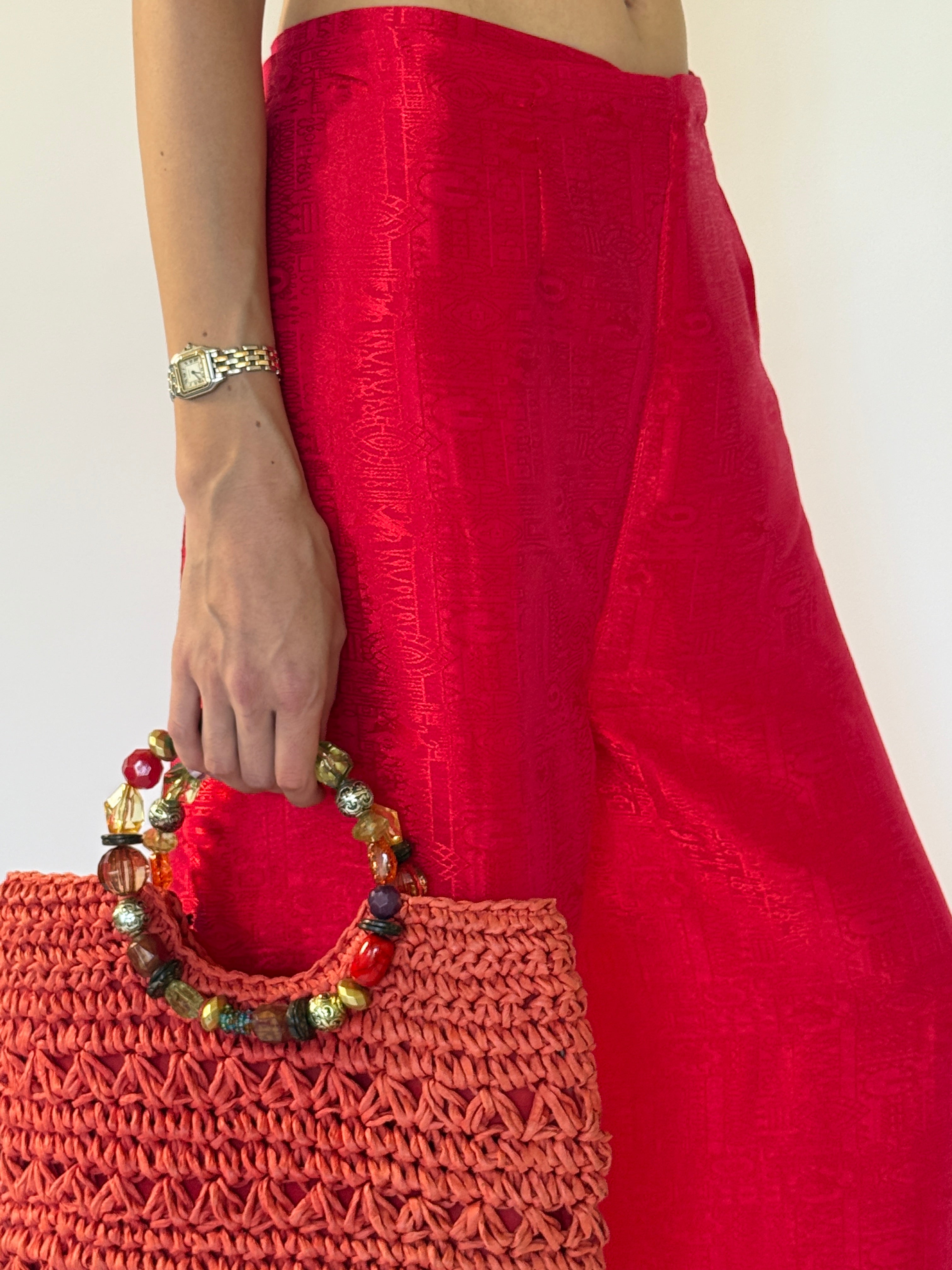 Vintage red wrap pants fabric close-up