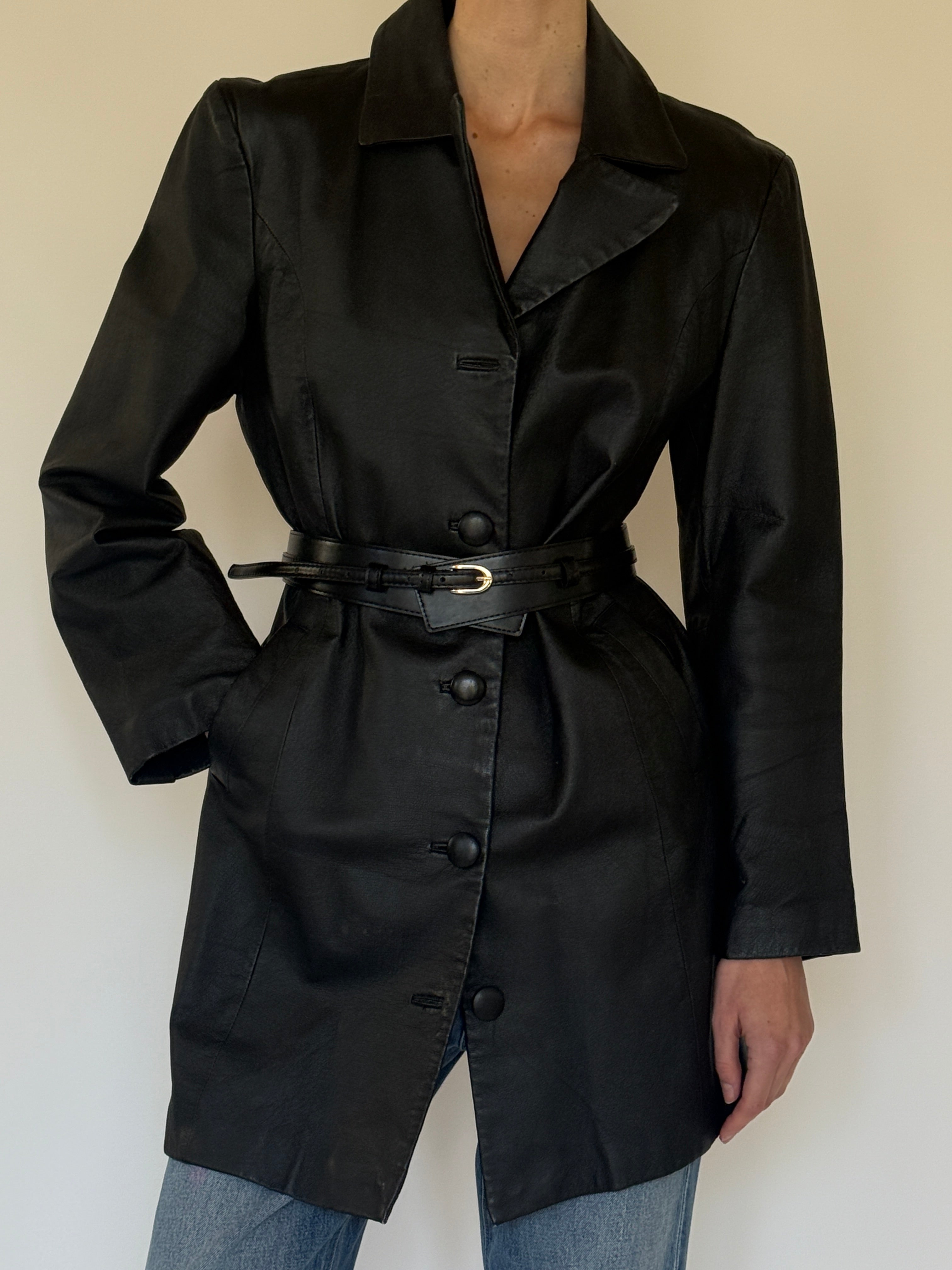 Vintage black leather coat collar detail close-up