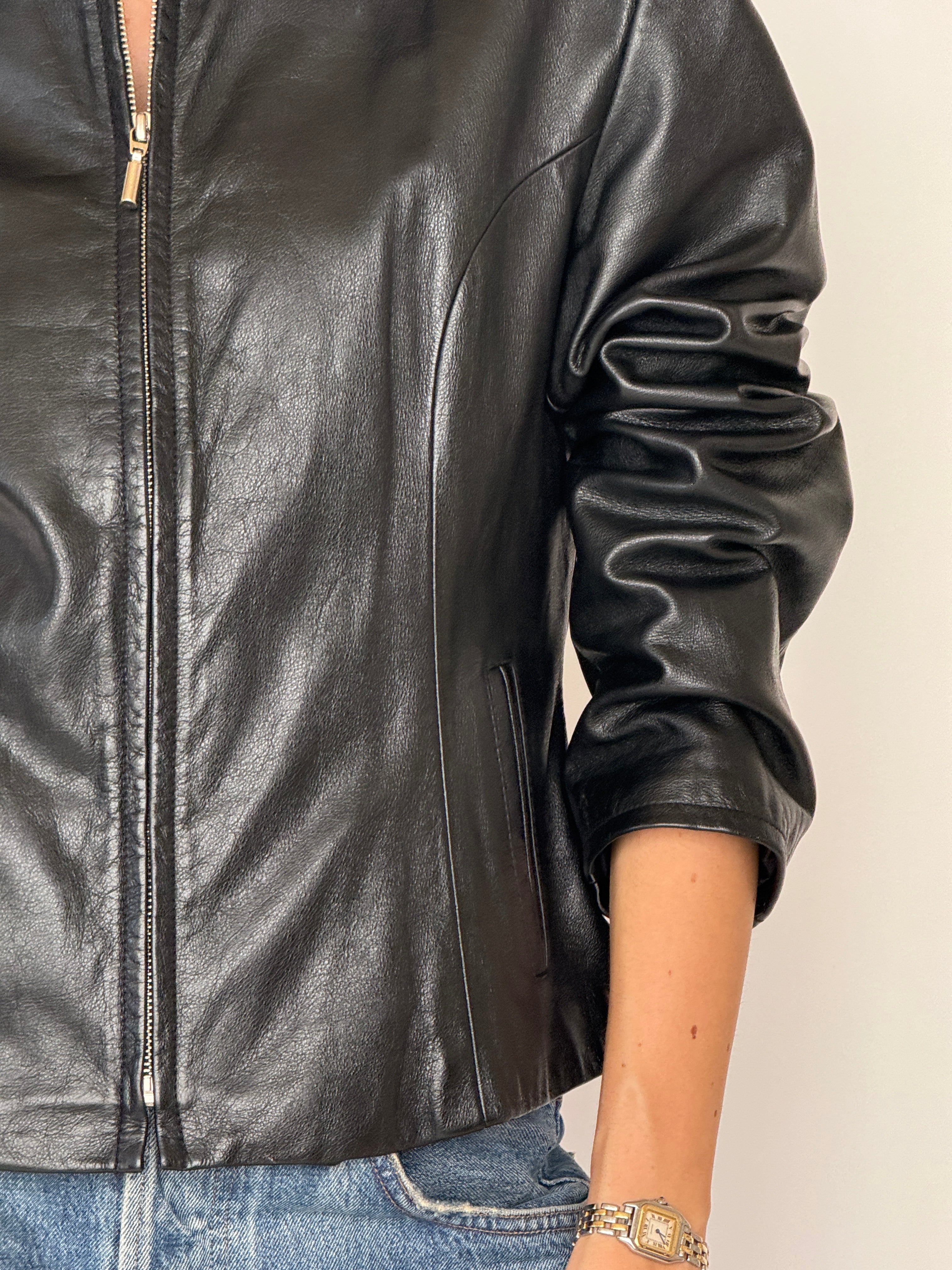 Vintage black leather jacket sleeve detail