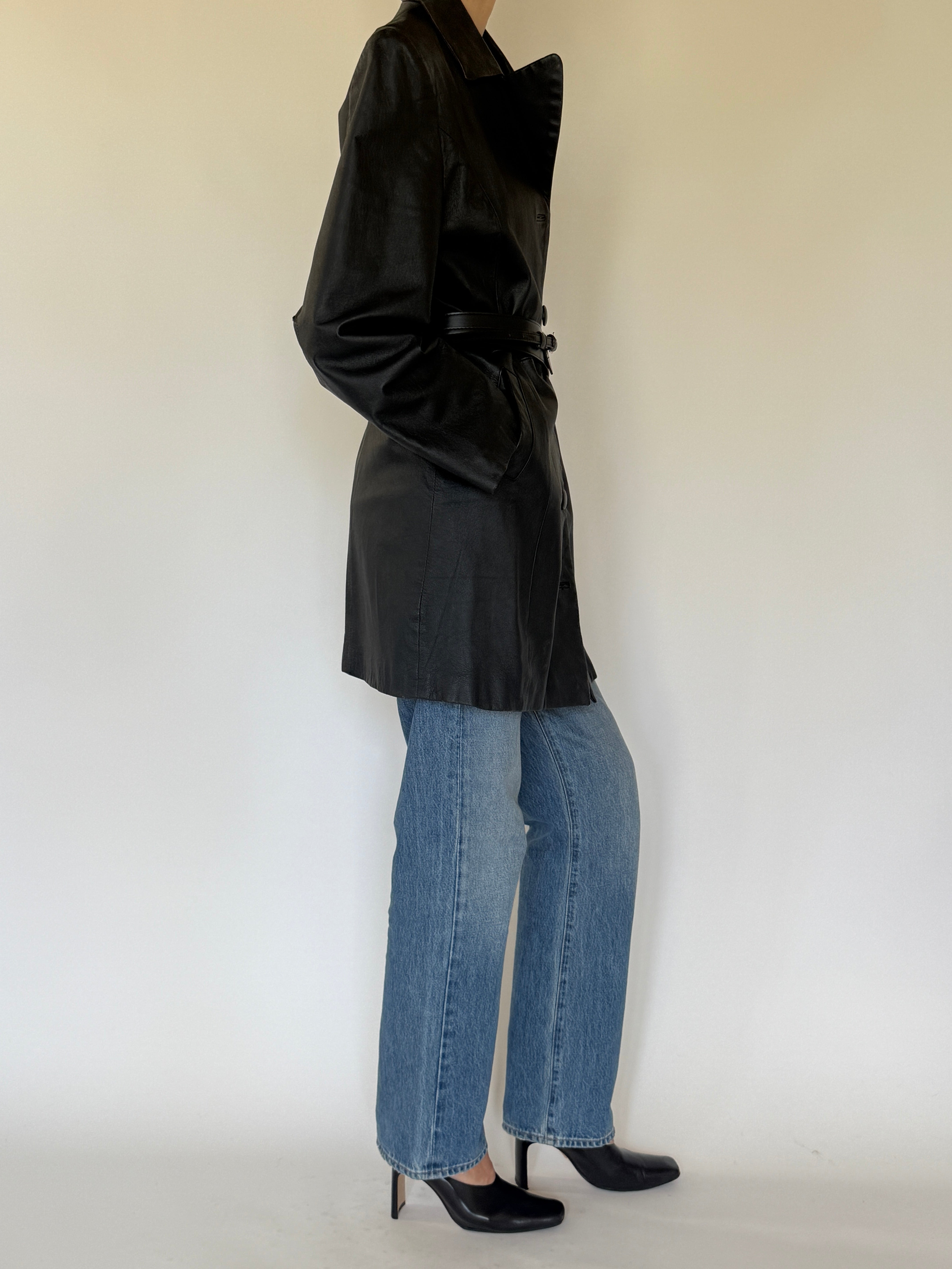 Vintage black leather coat side view structured silhouette