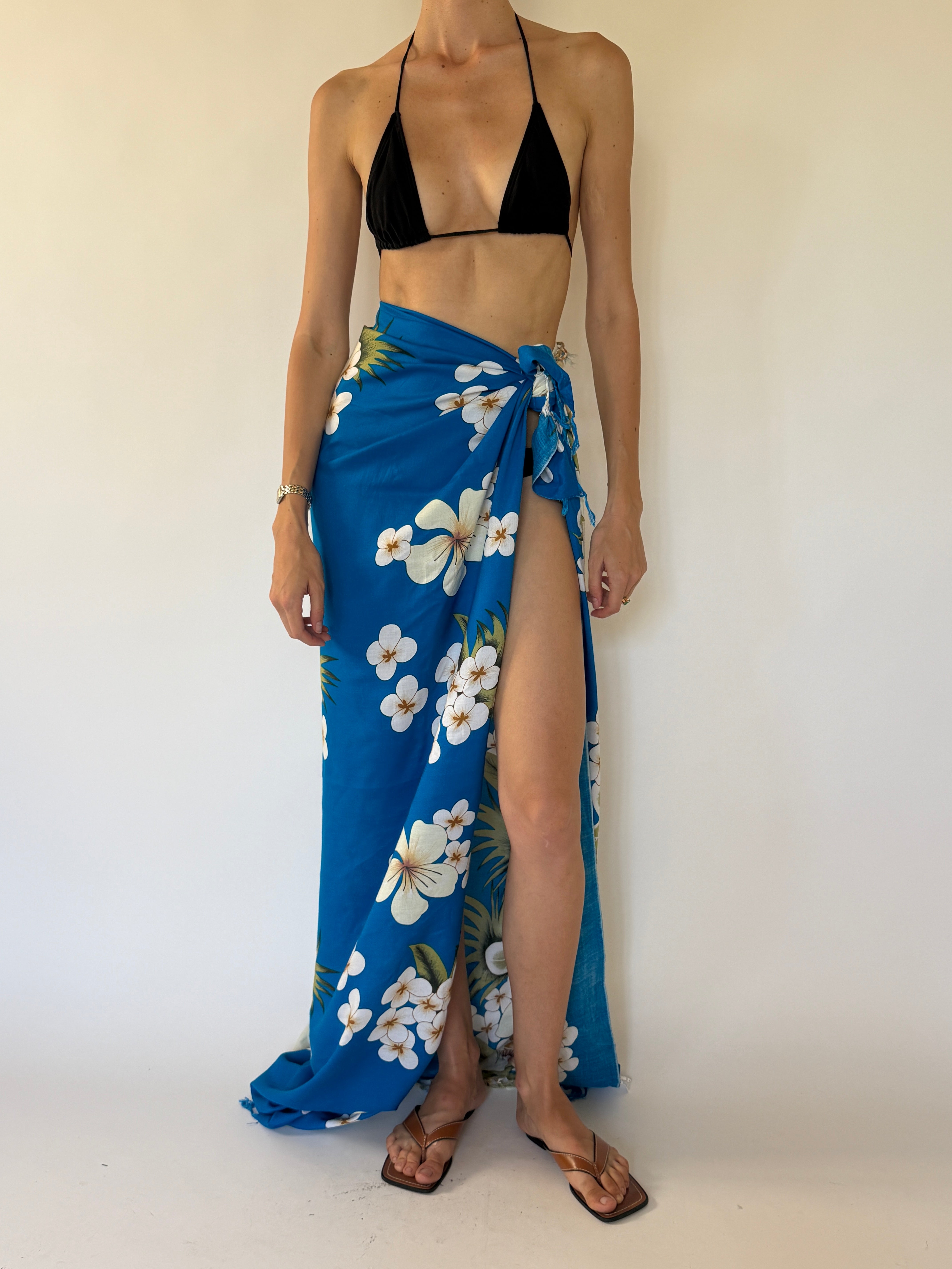 Vintage tropical blue floral beach pareo tied as a sarong