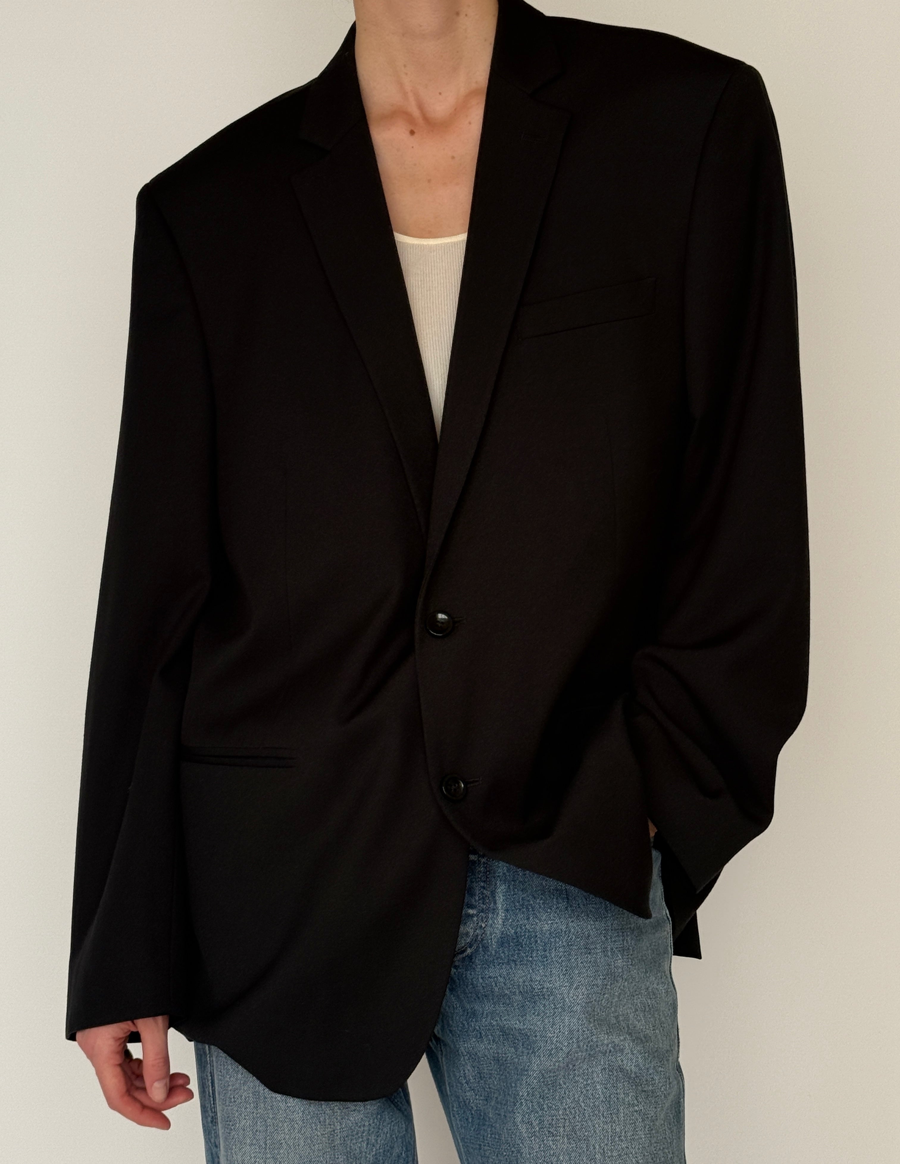 Vintage black single-breasted blazer front pocket detail