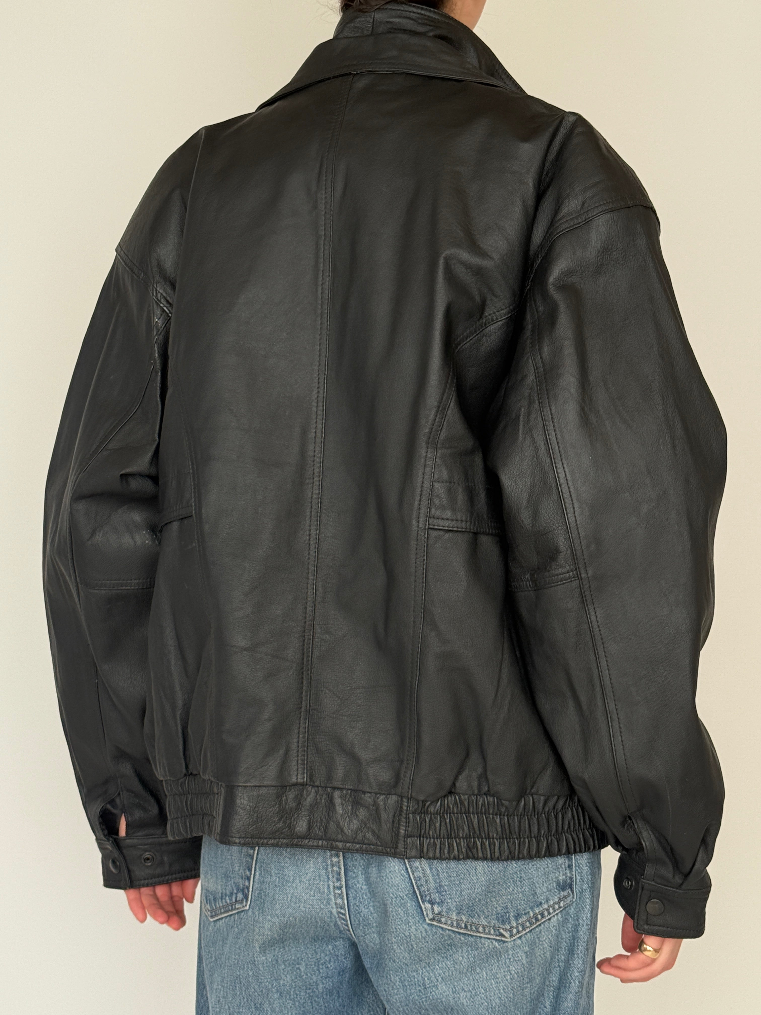 Vintage black leather jacket back view