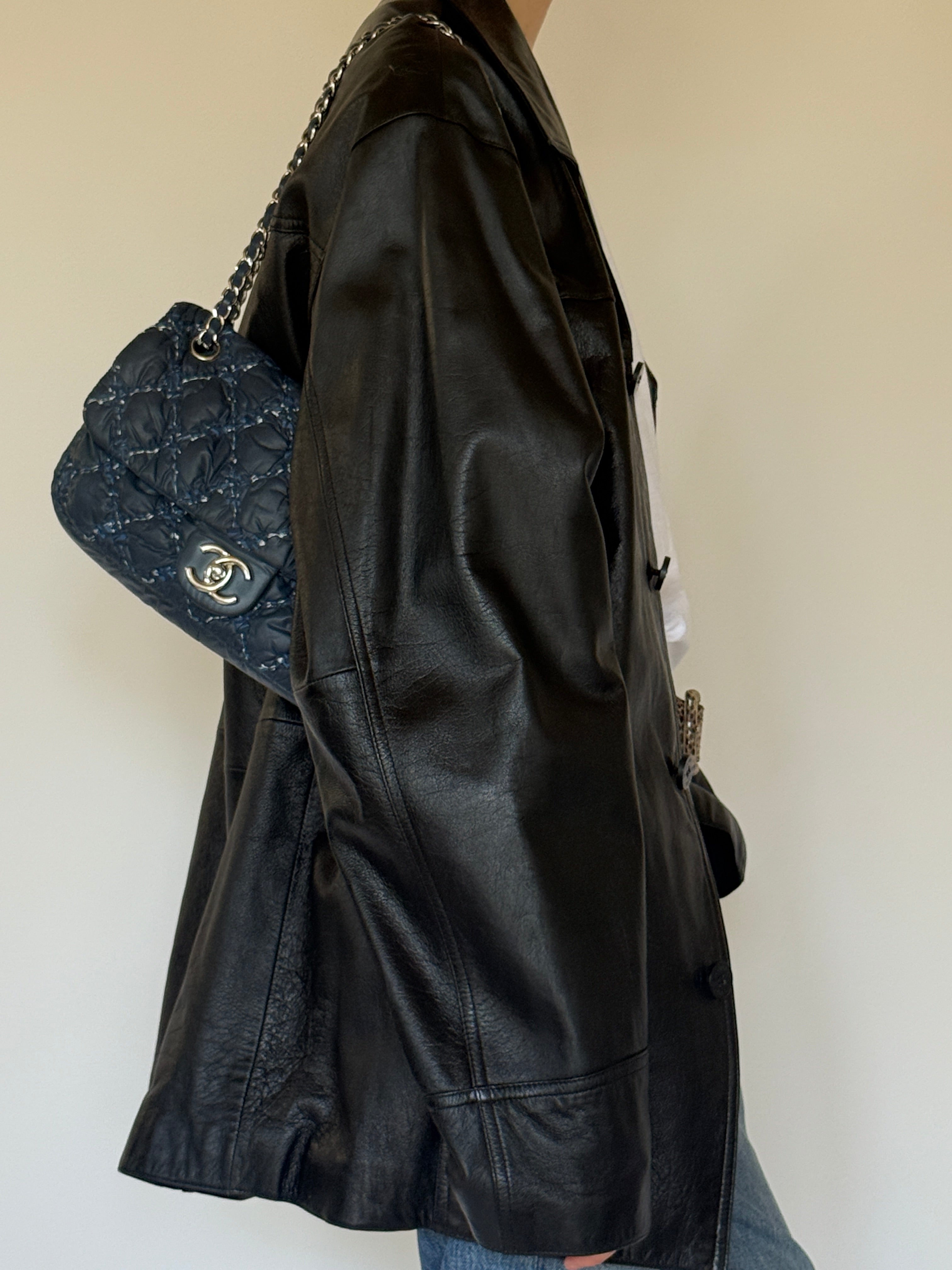 Vintage black leather jacket side view