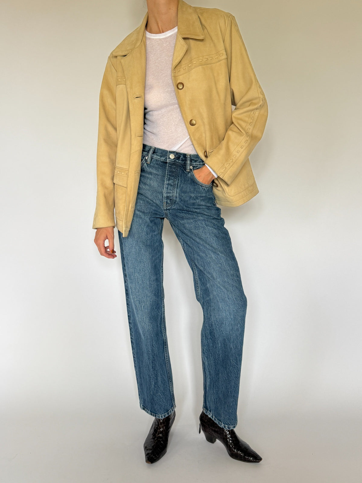 Vintage western-inspired leather jacket tan button and sleeve detail