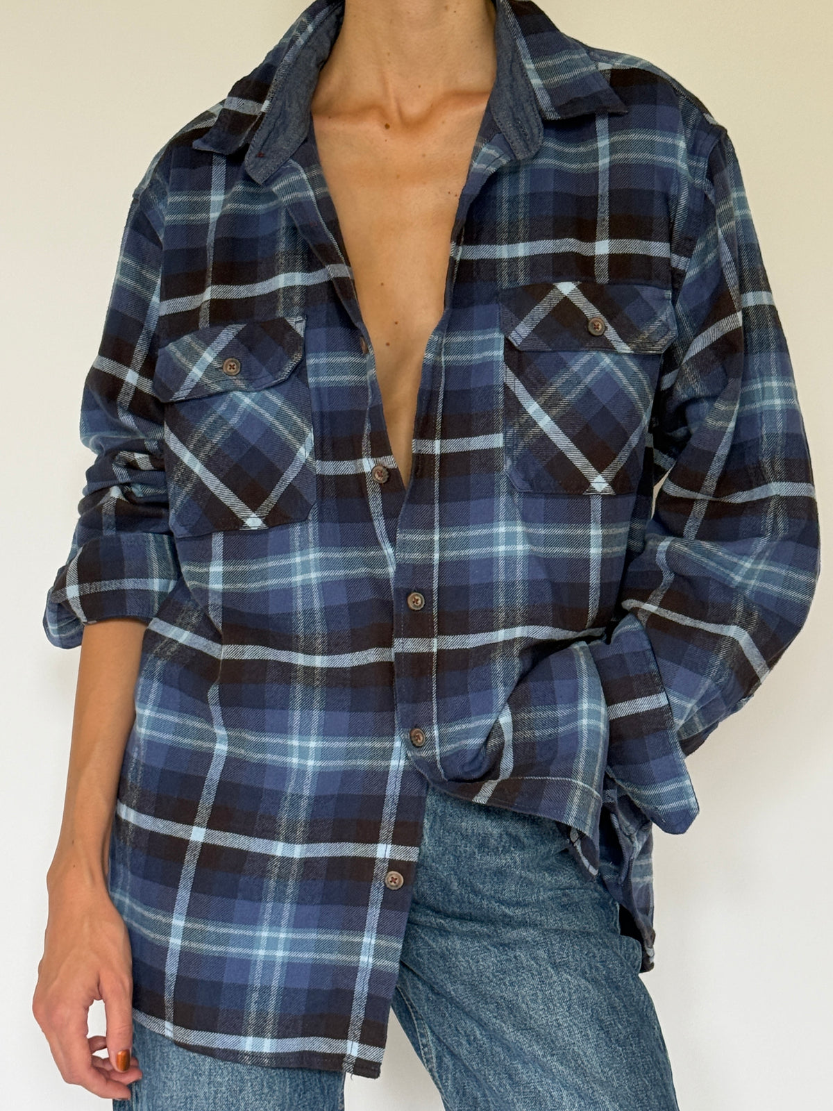 Vintage blue plaid flannel shirt 100% cotton fabric close-up