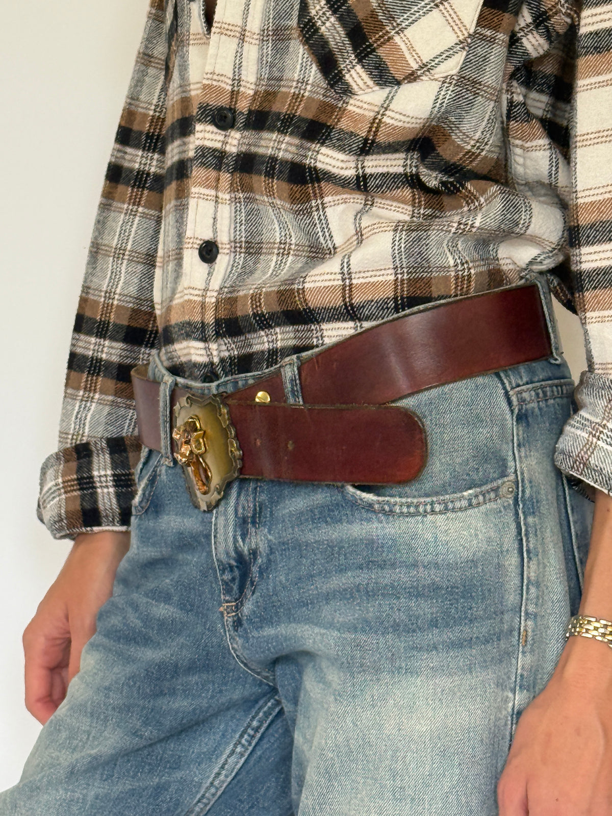 Vintage brown leather ram buckle belt side view