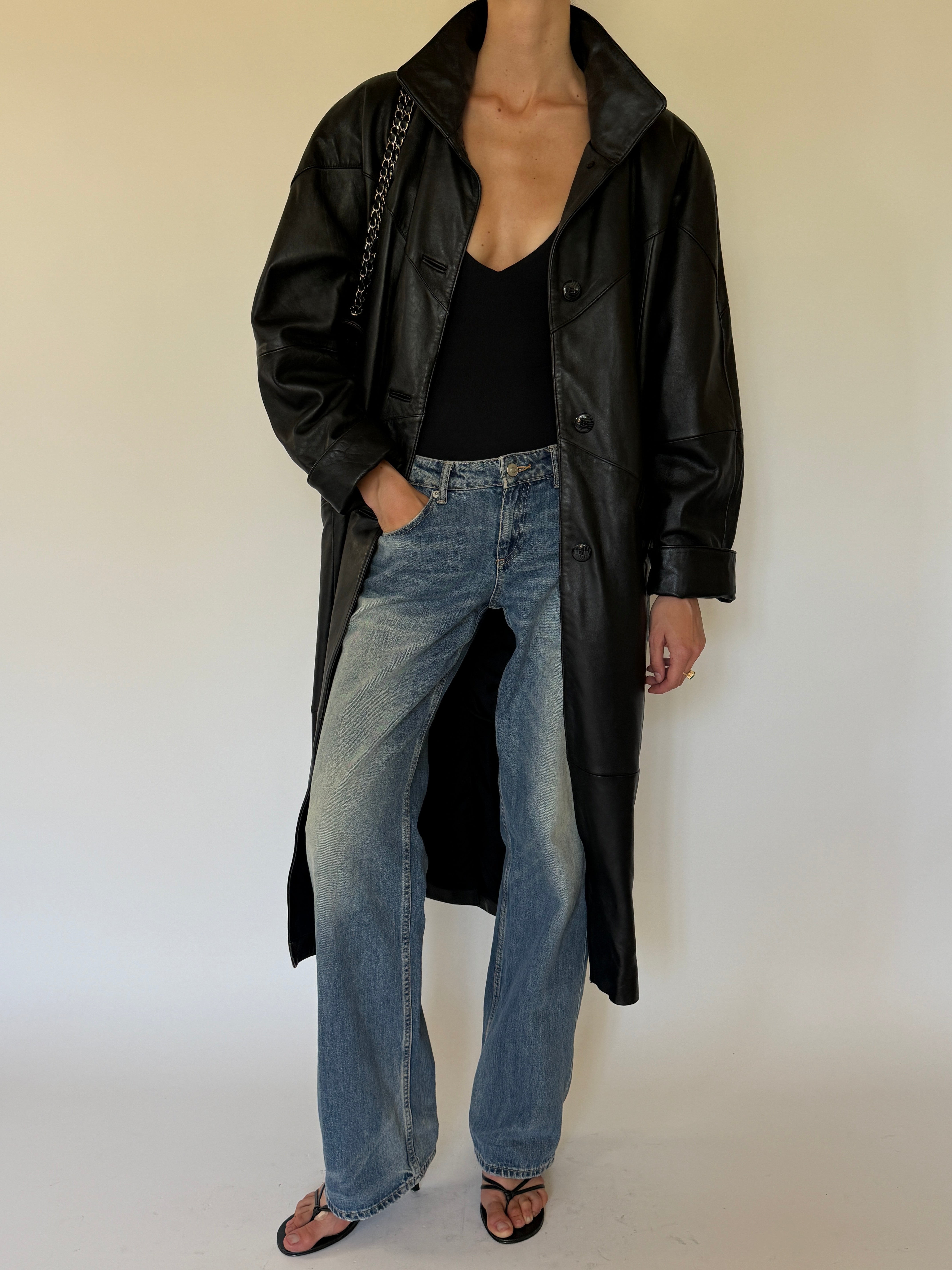 Vintage black leather coat front angle