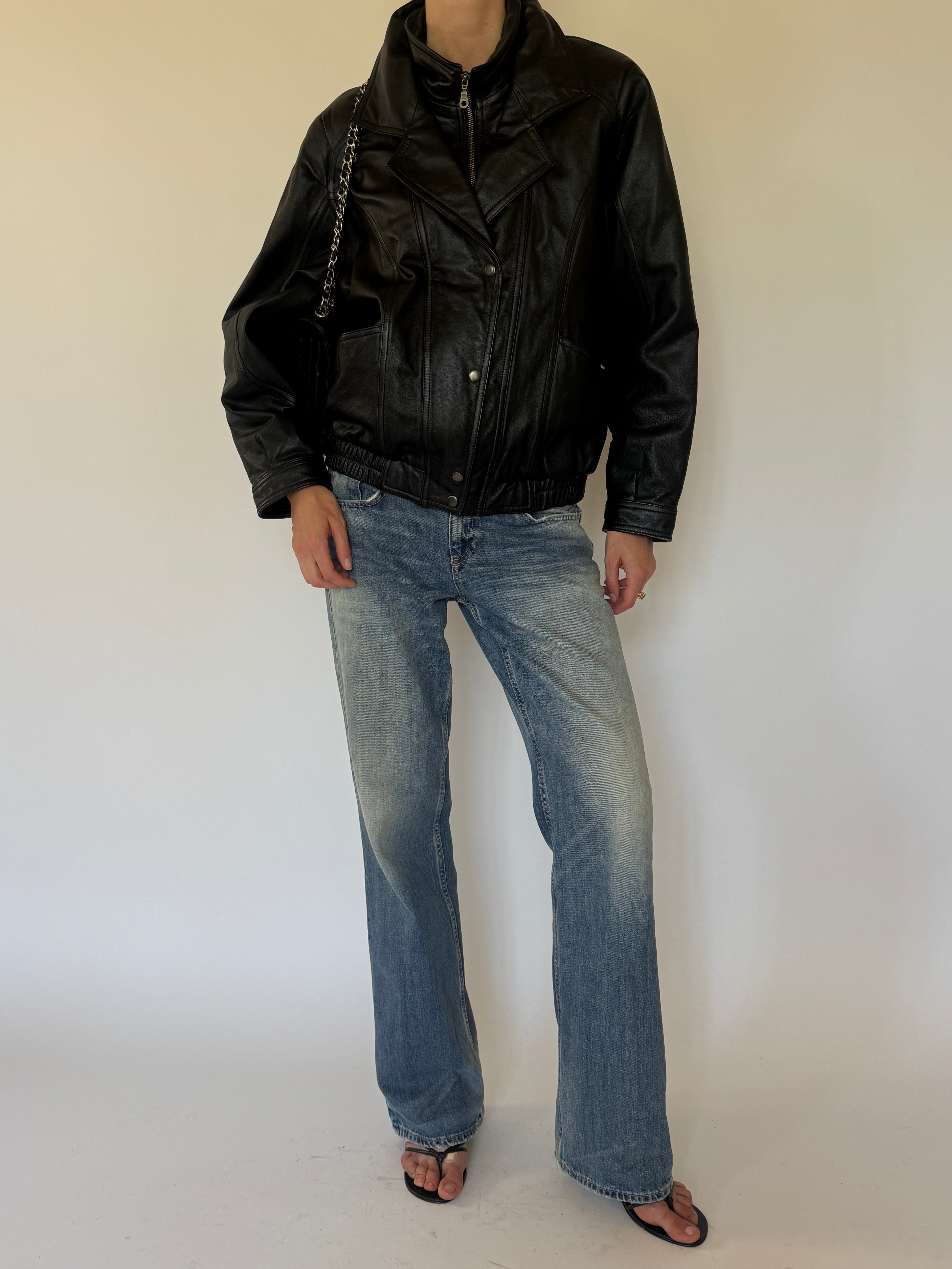 Vintage oversized black leather bomber jacket front view
