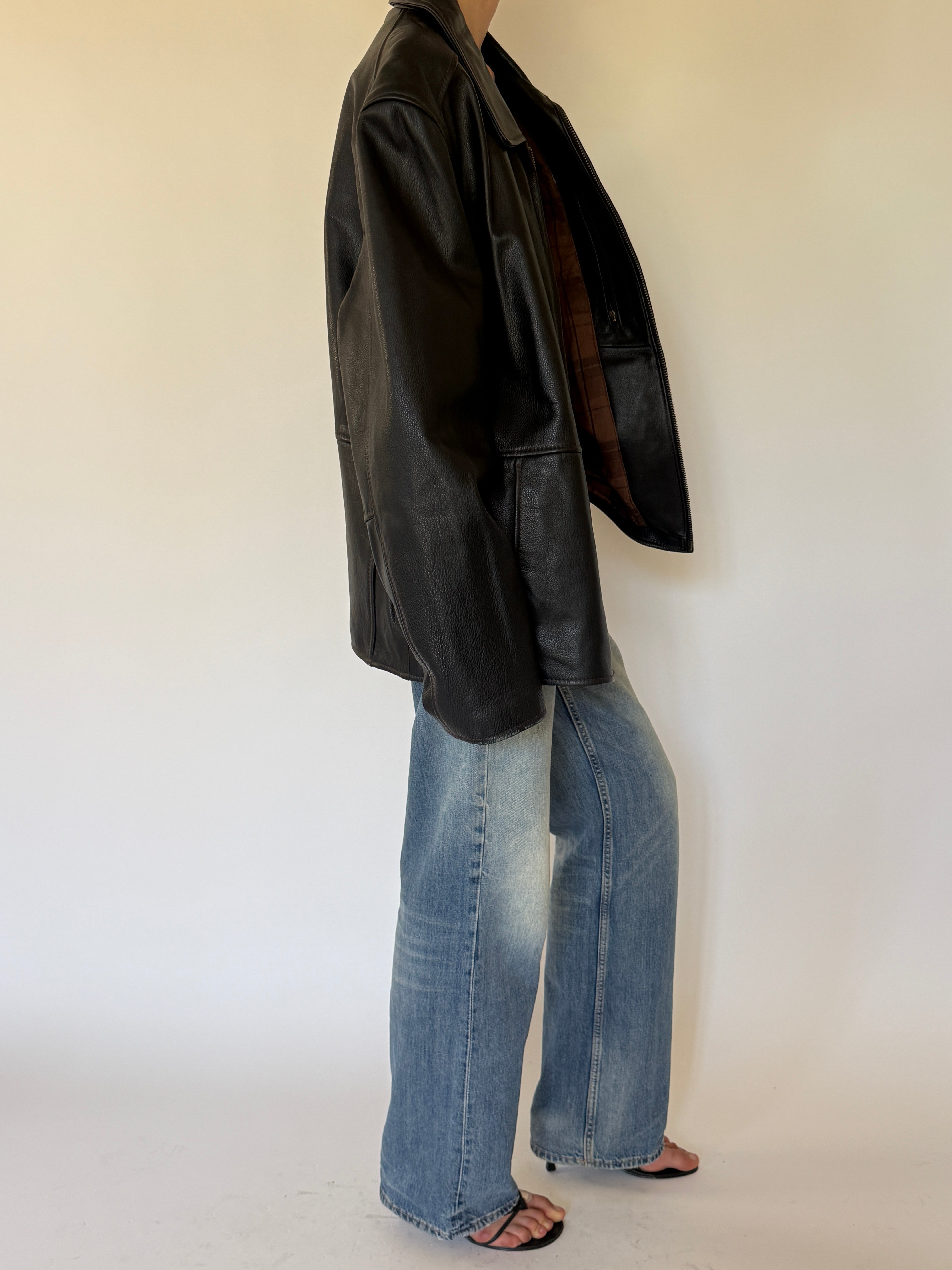 Vintage oversized black leather jacket side view