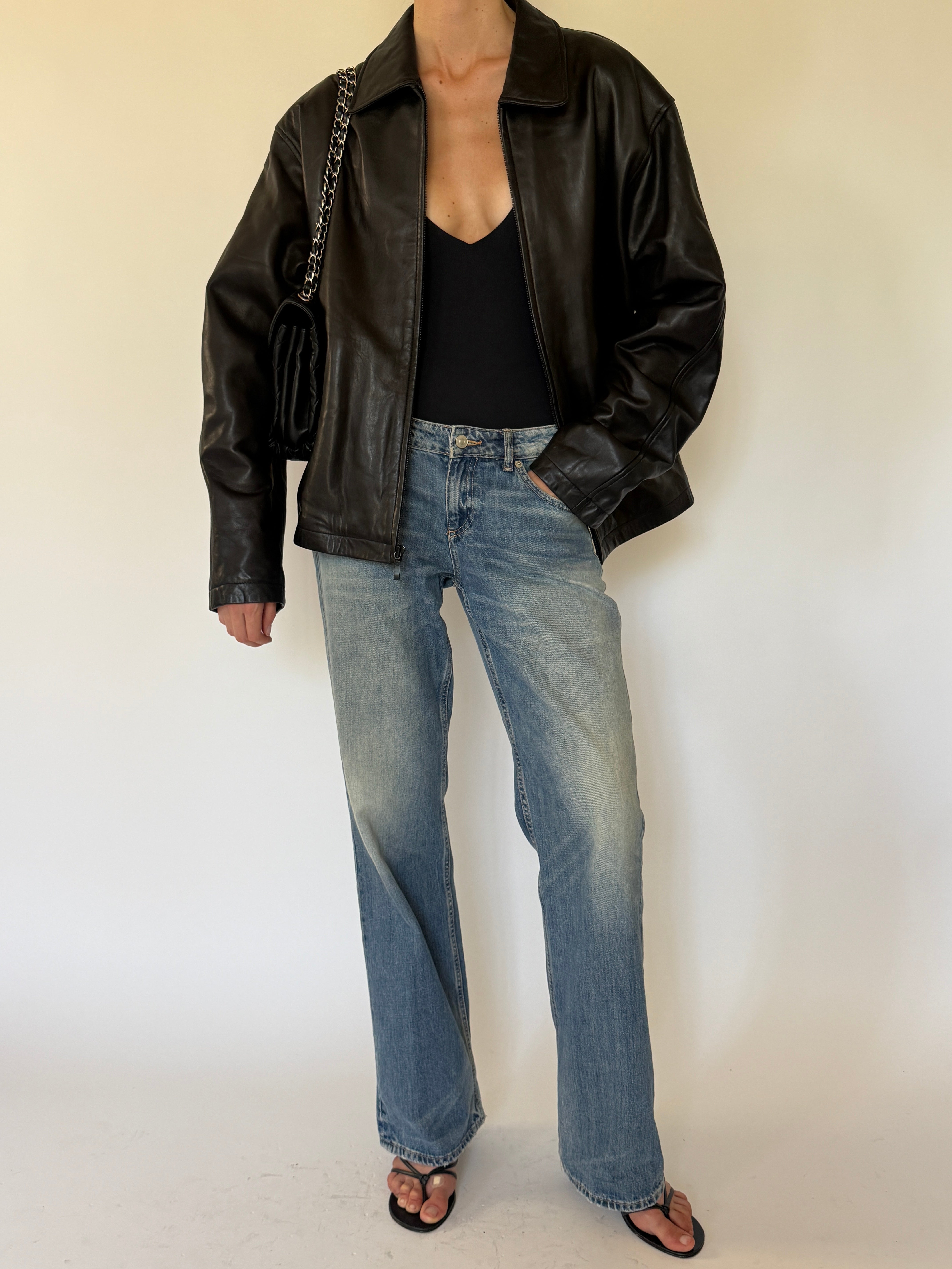 Vintage oversized black leather jacket front view