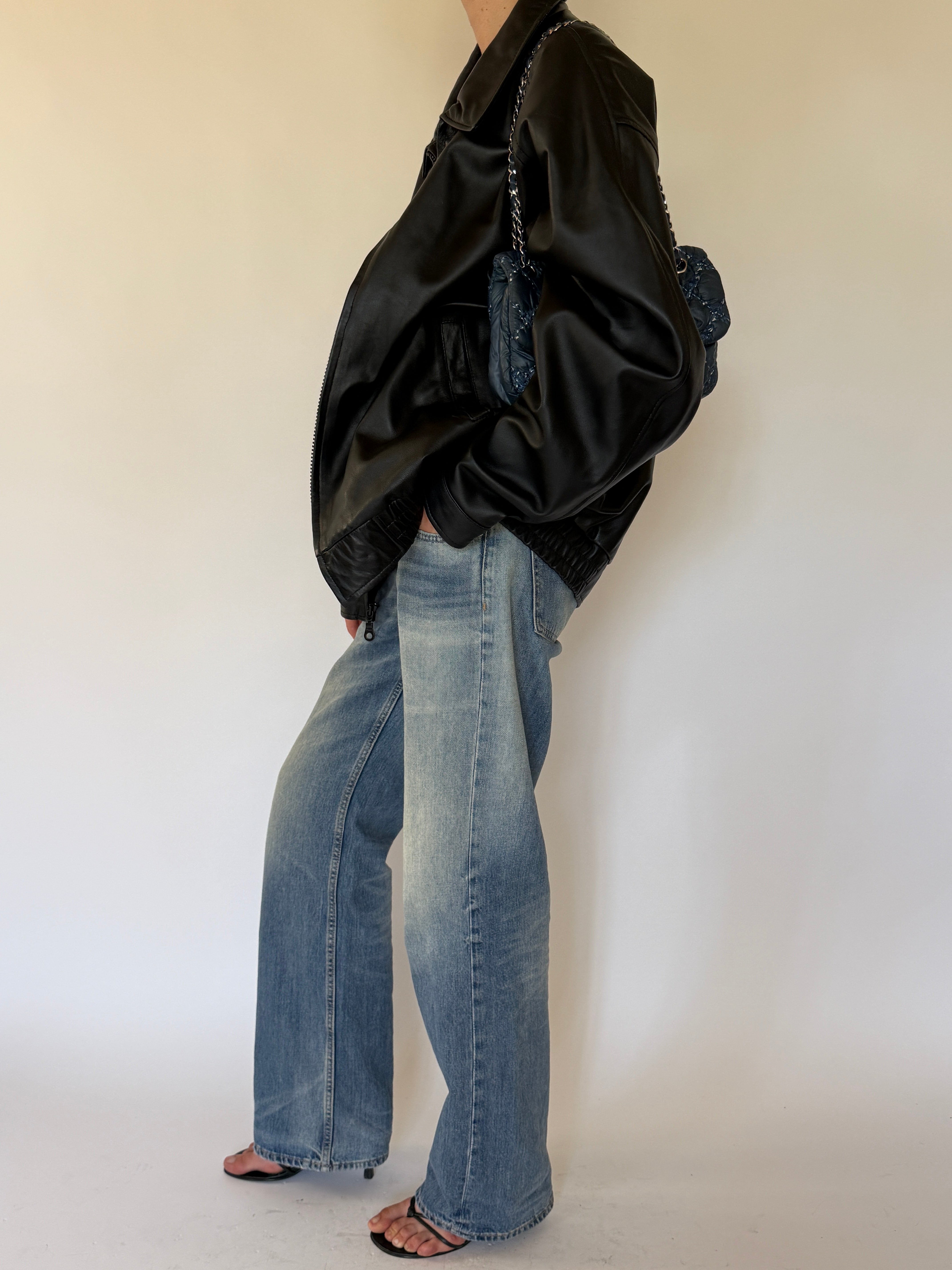 Vintage black leather jacket side angle