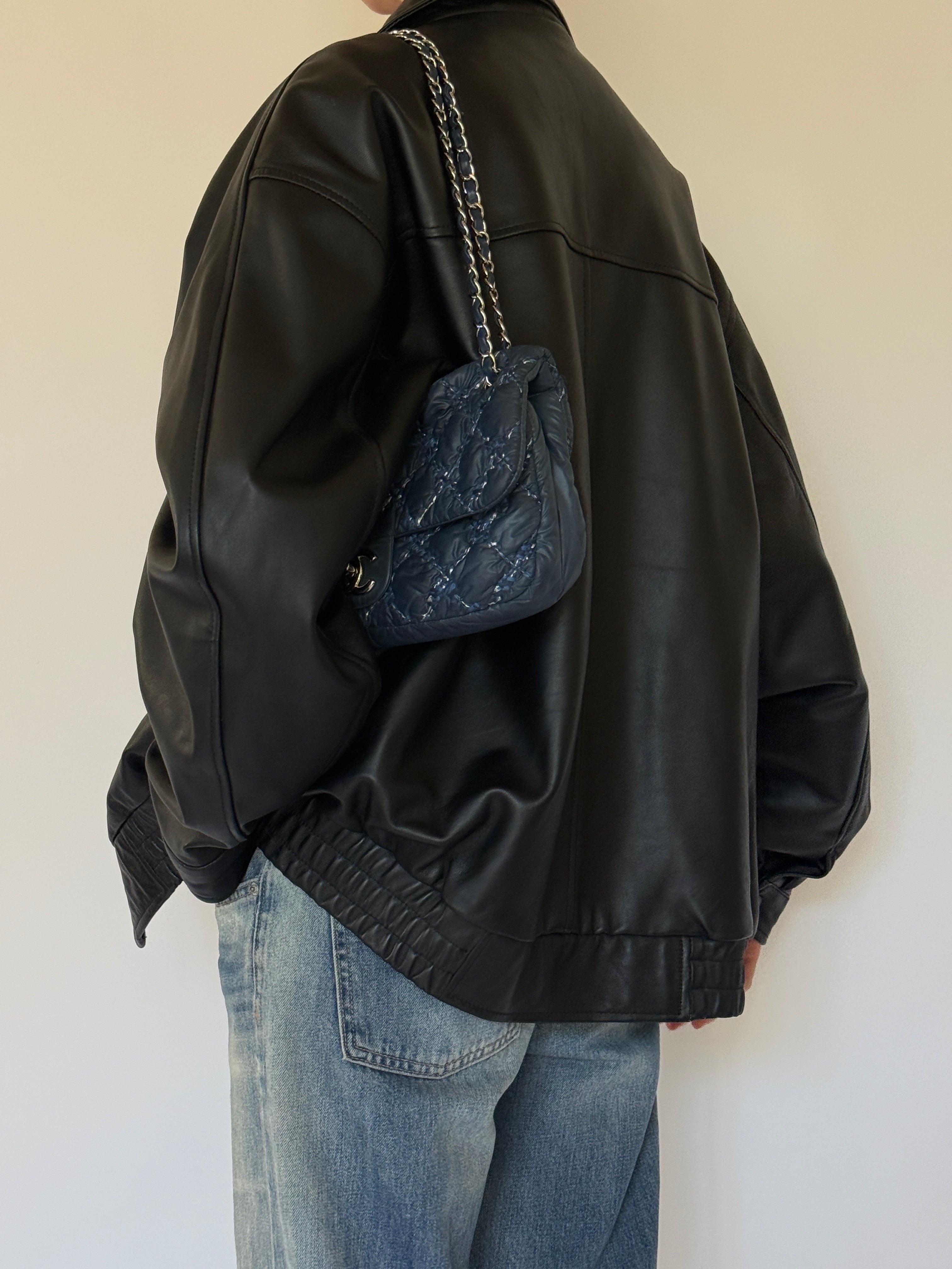 Vintage oversized black leather jacket back view