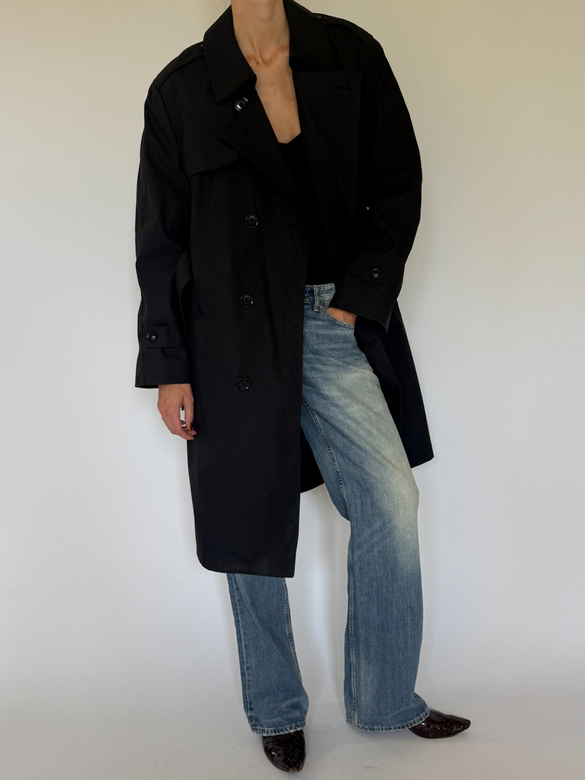 Vintage black belted trench coat front view