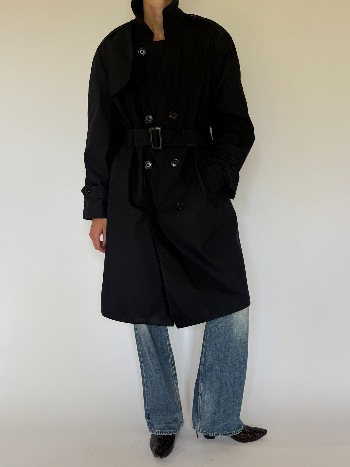 Vintage black belted trench coat side view