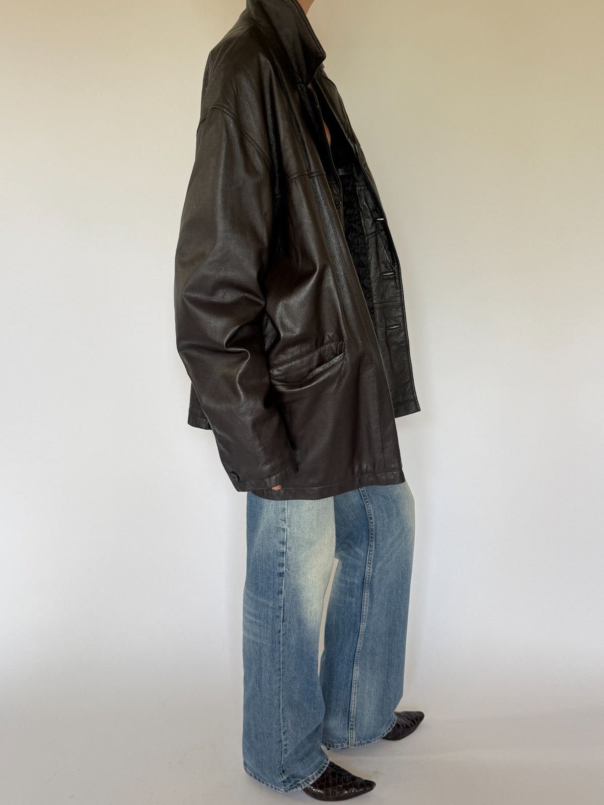 Vintage oversized dark brown leather jacket side view