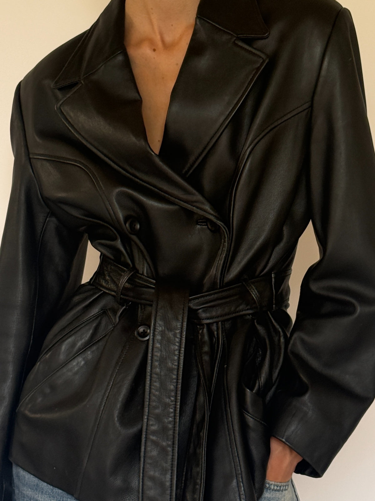 Vintage black leather belted jacket front view