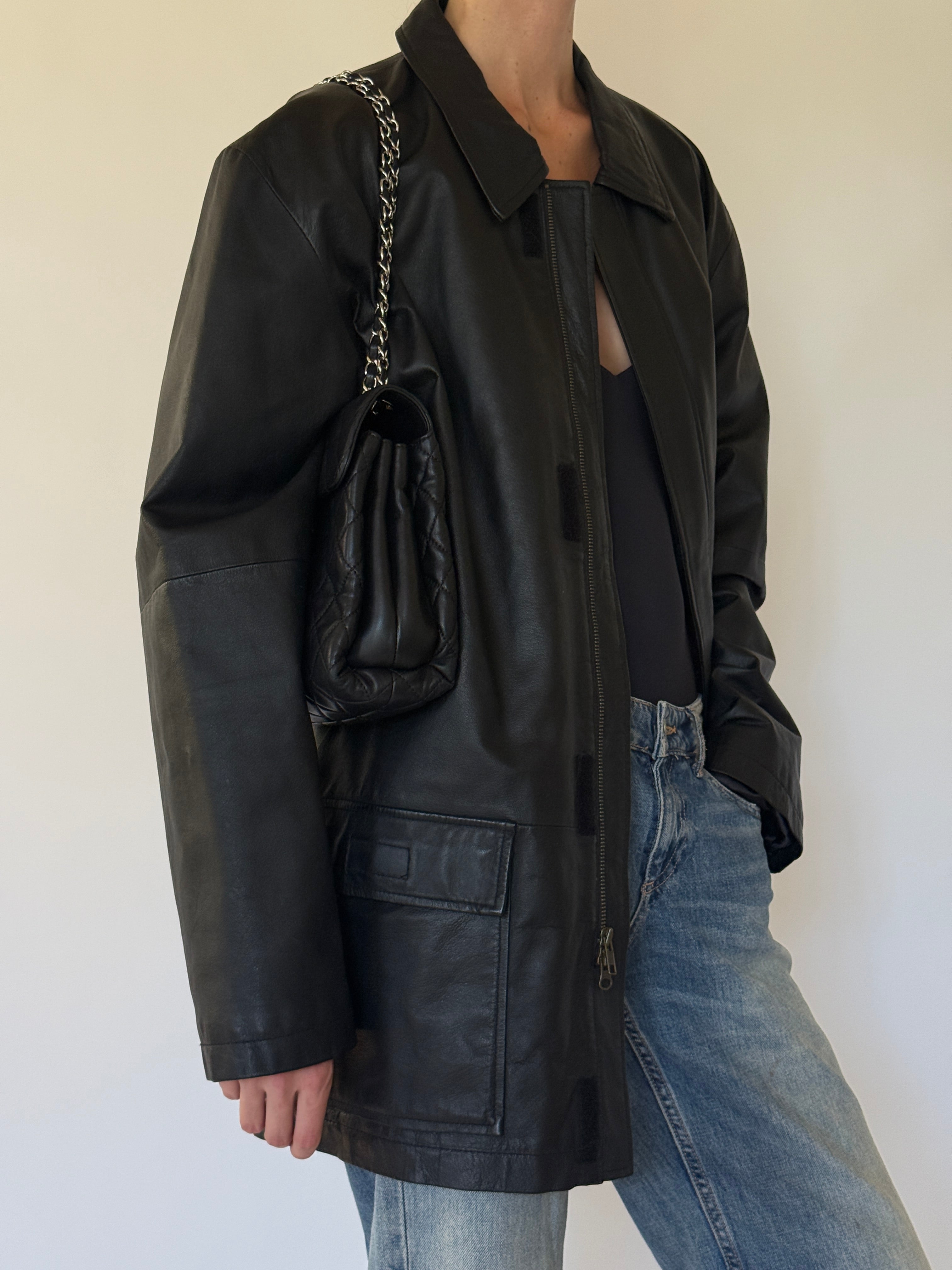 Vintage black leather jacket side view
