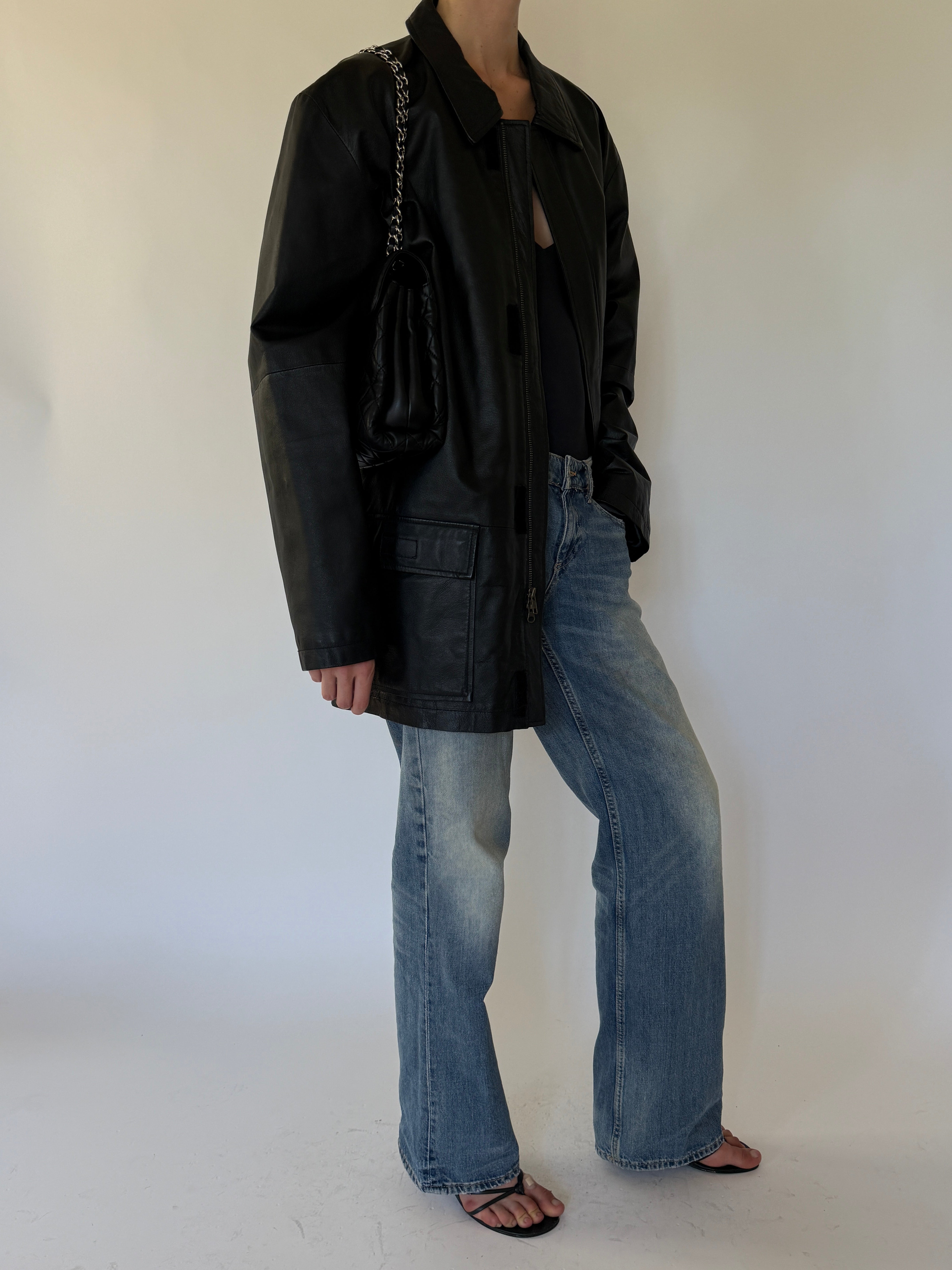 Vintage black leather jacket side view
