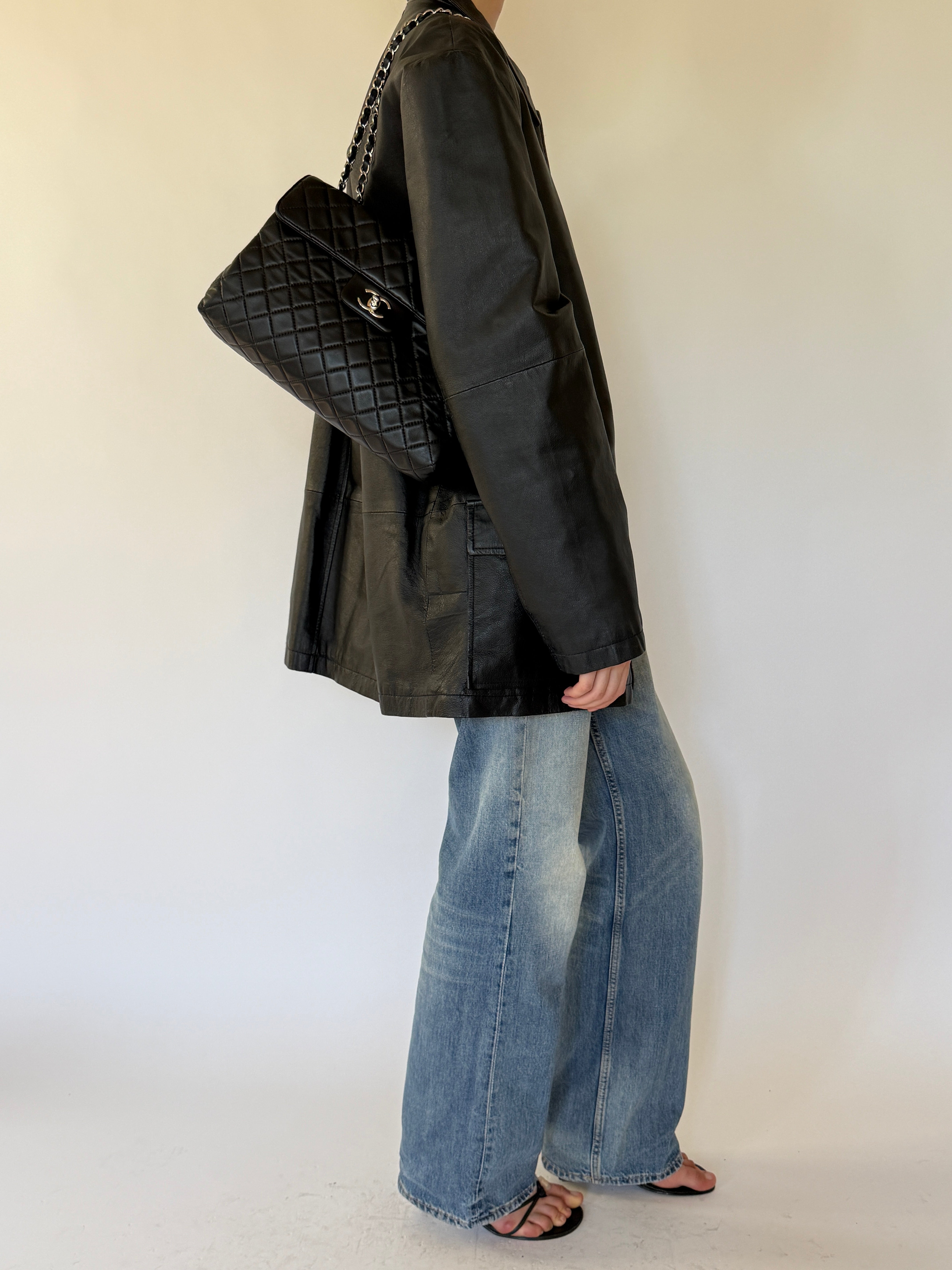 Vintage black leather jacket side view