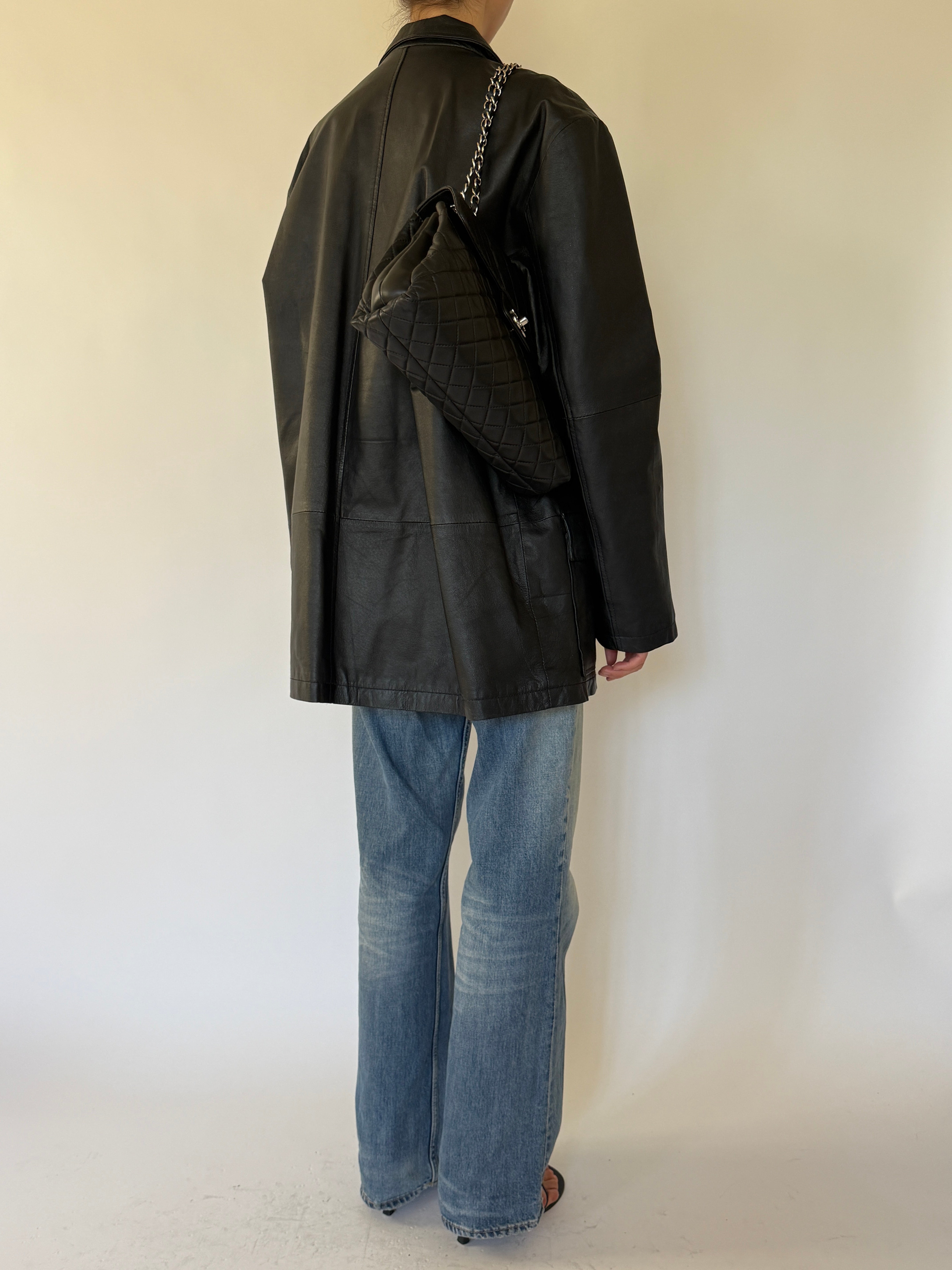 Vintage black leather jacket back view