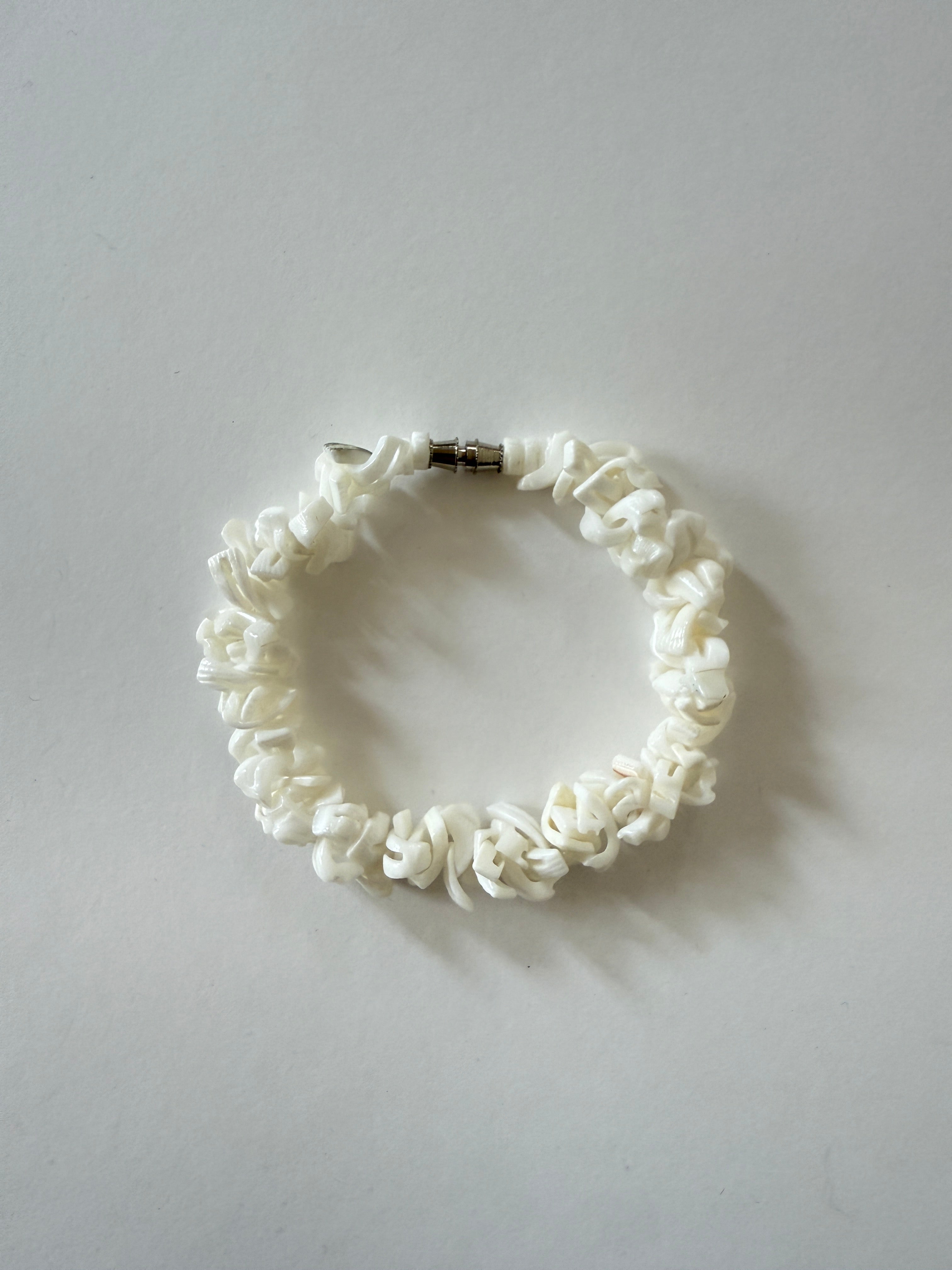 Vintage shell chip bracelet laid flat