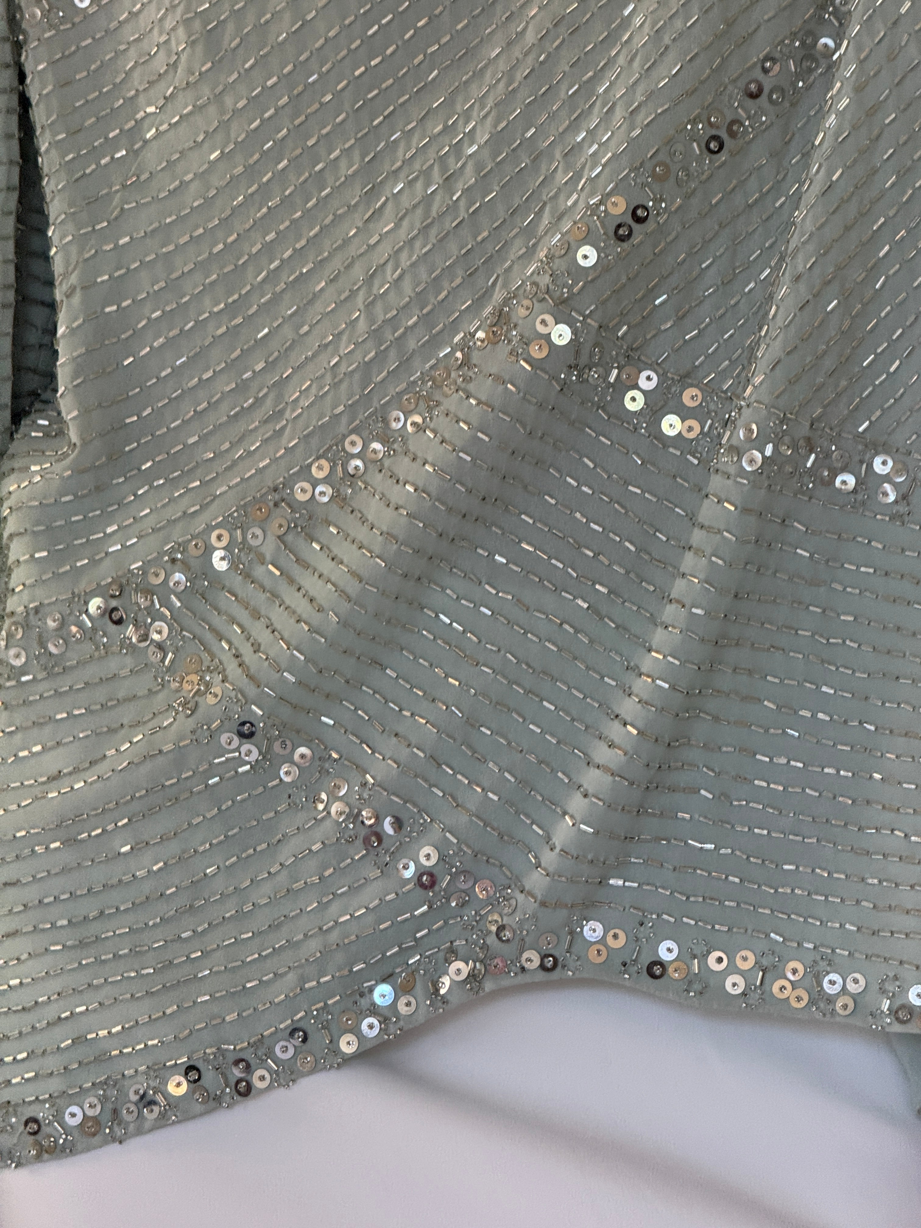Vintage silver bugle bead and sequin fabric close-up