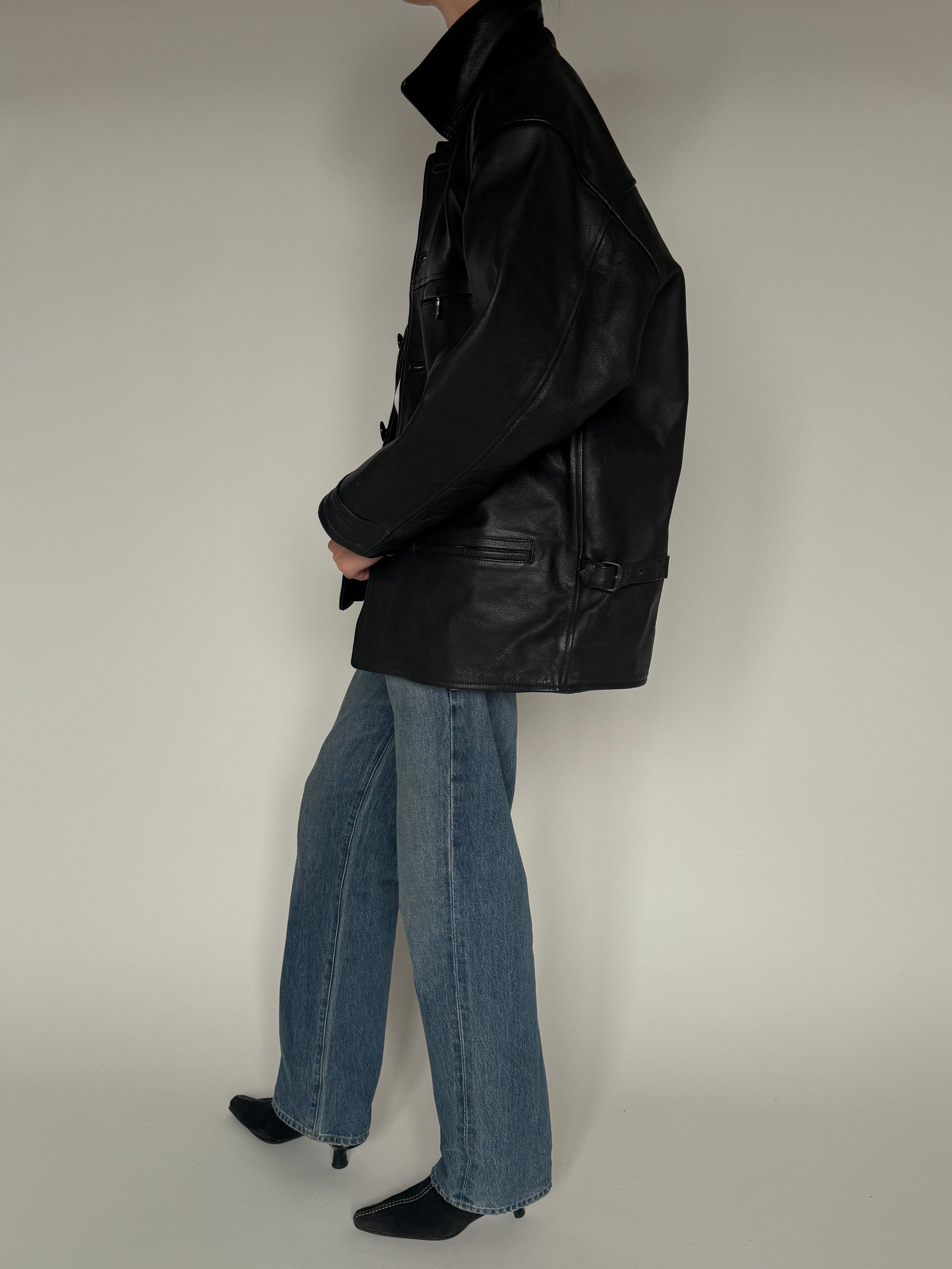 Vintage black leather jacket side view