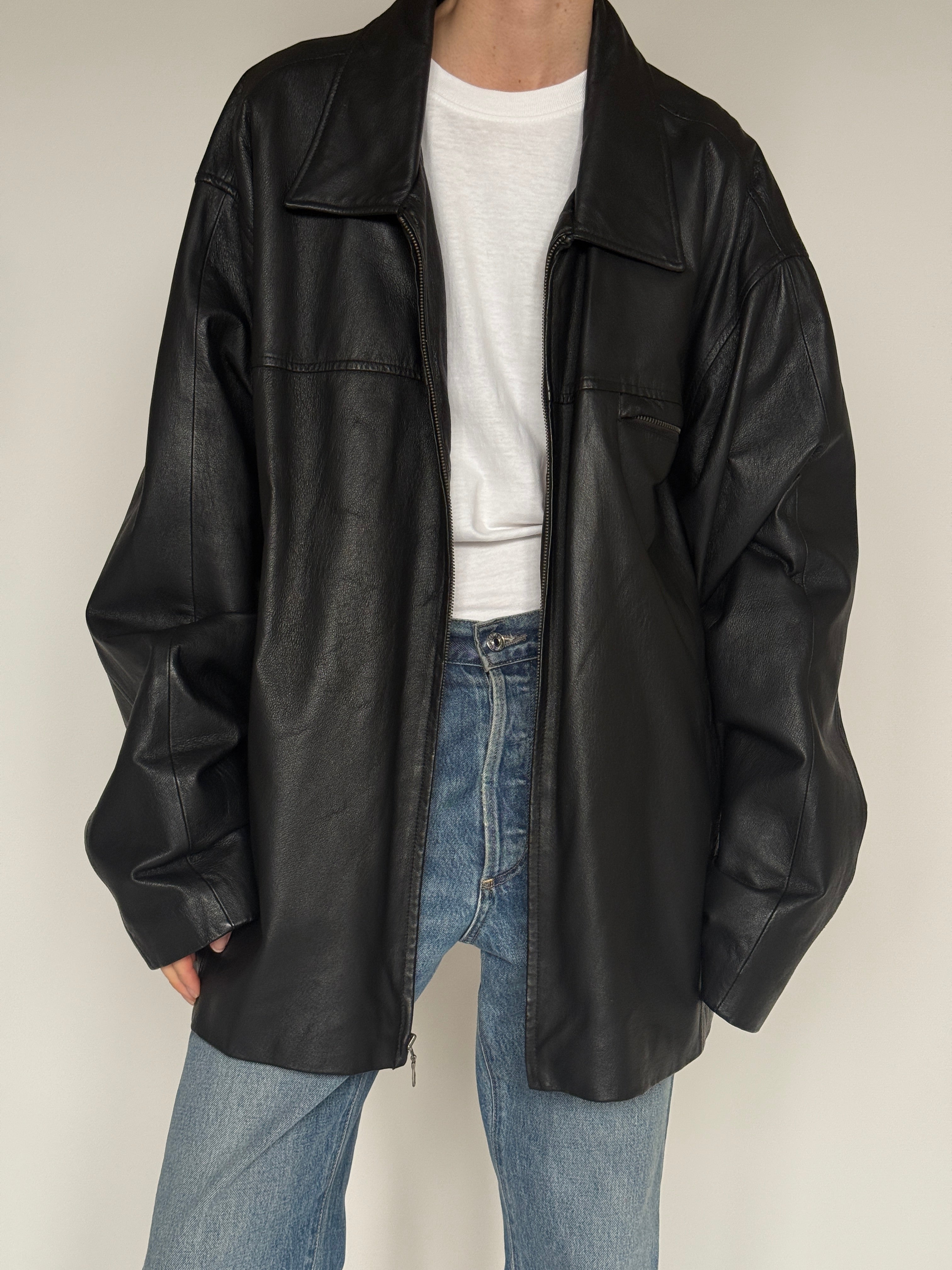 Vintage black leather jacket chest pocket detail