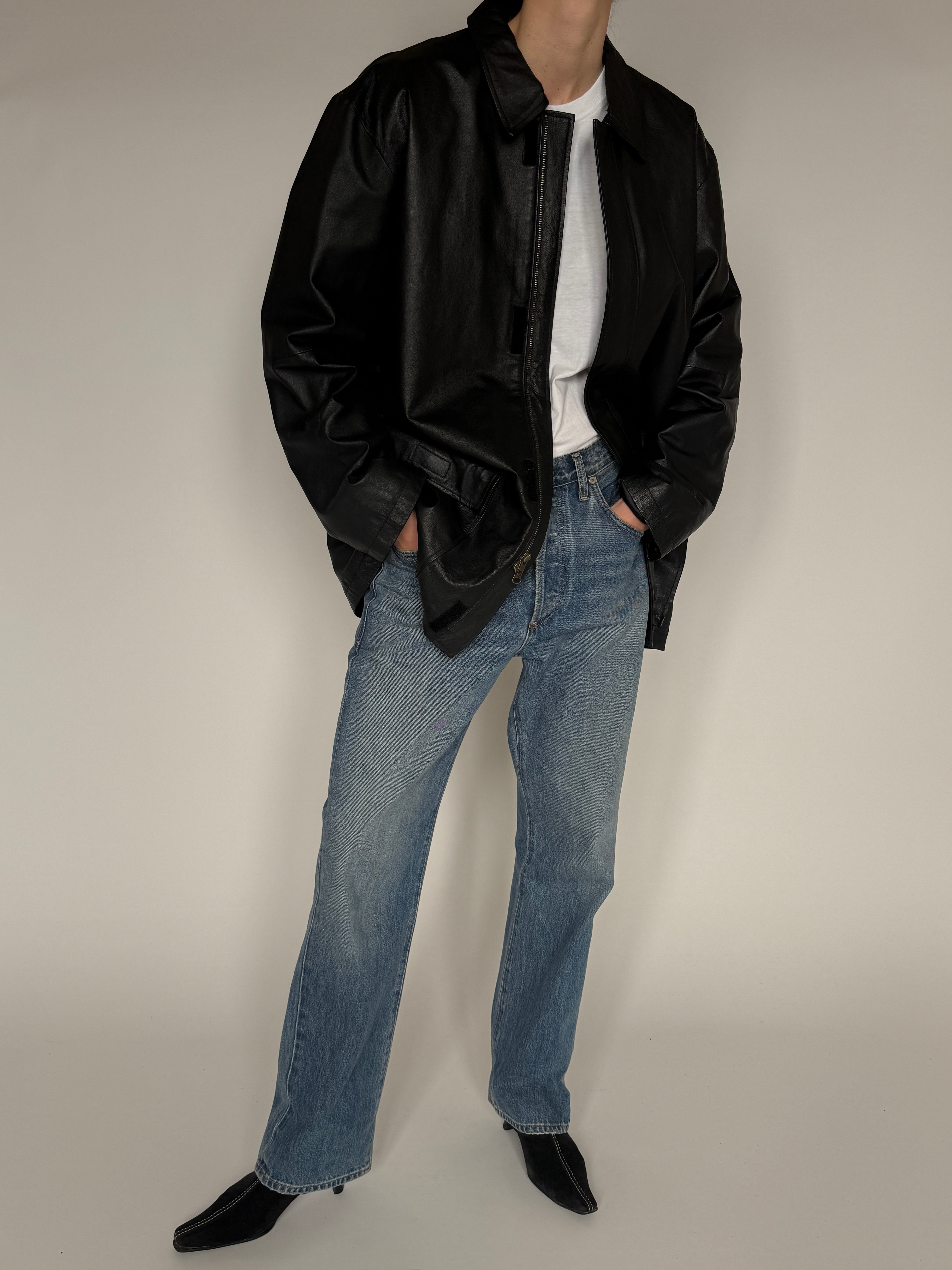 Vintage black leather jacket side view
