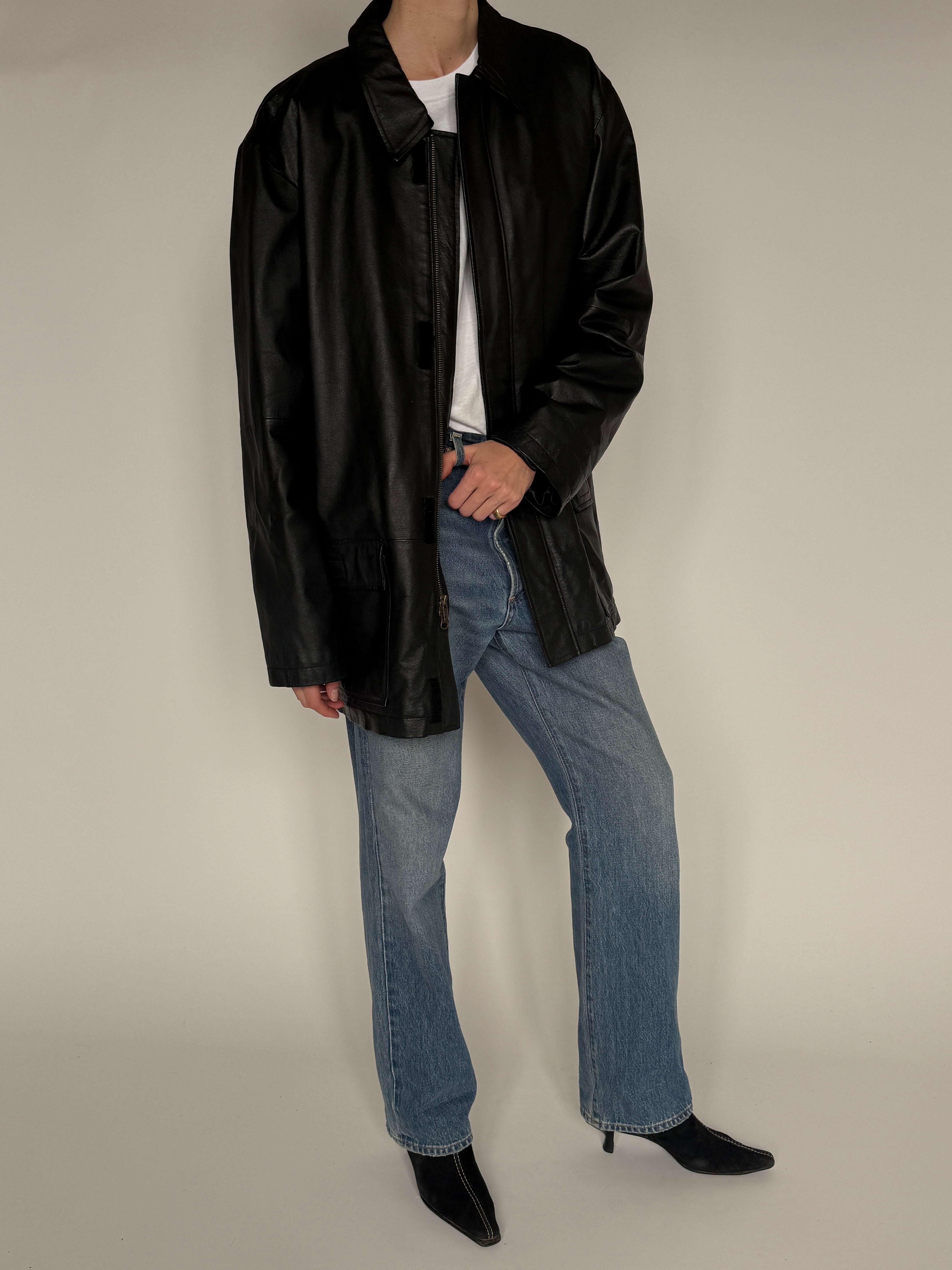 Vintage black leather jacket front pocket detail