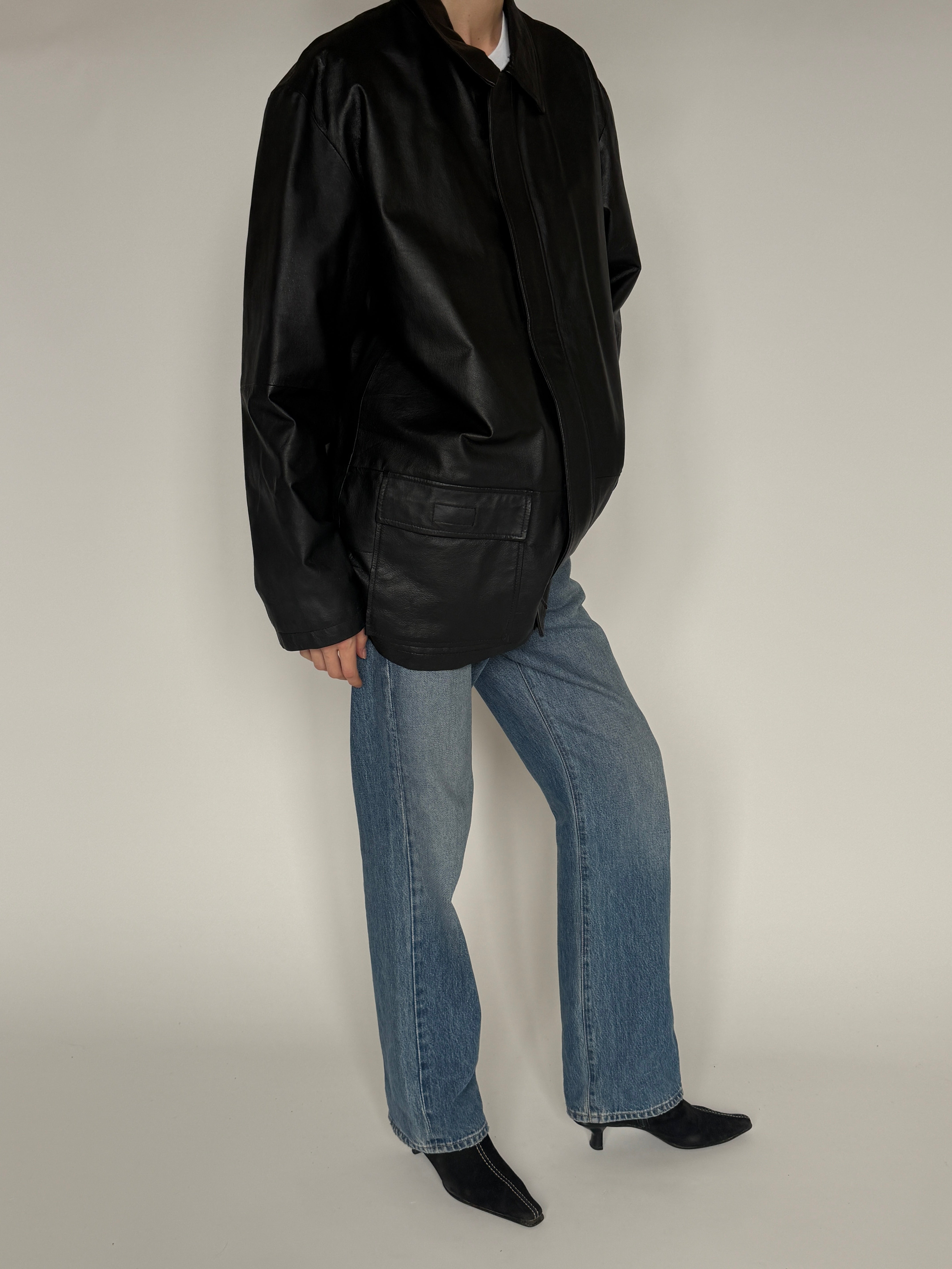 Vintage black leather jacket zip closure detail