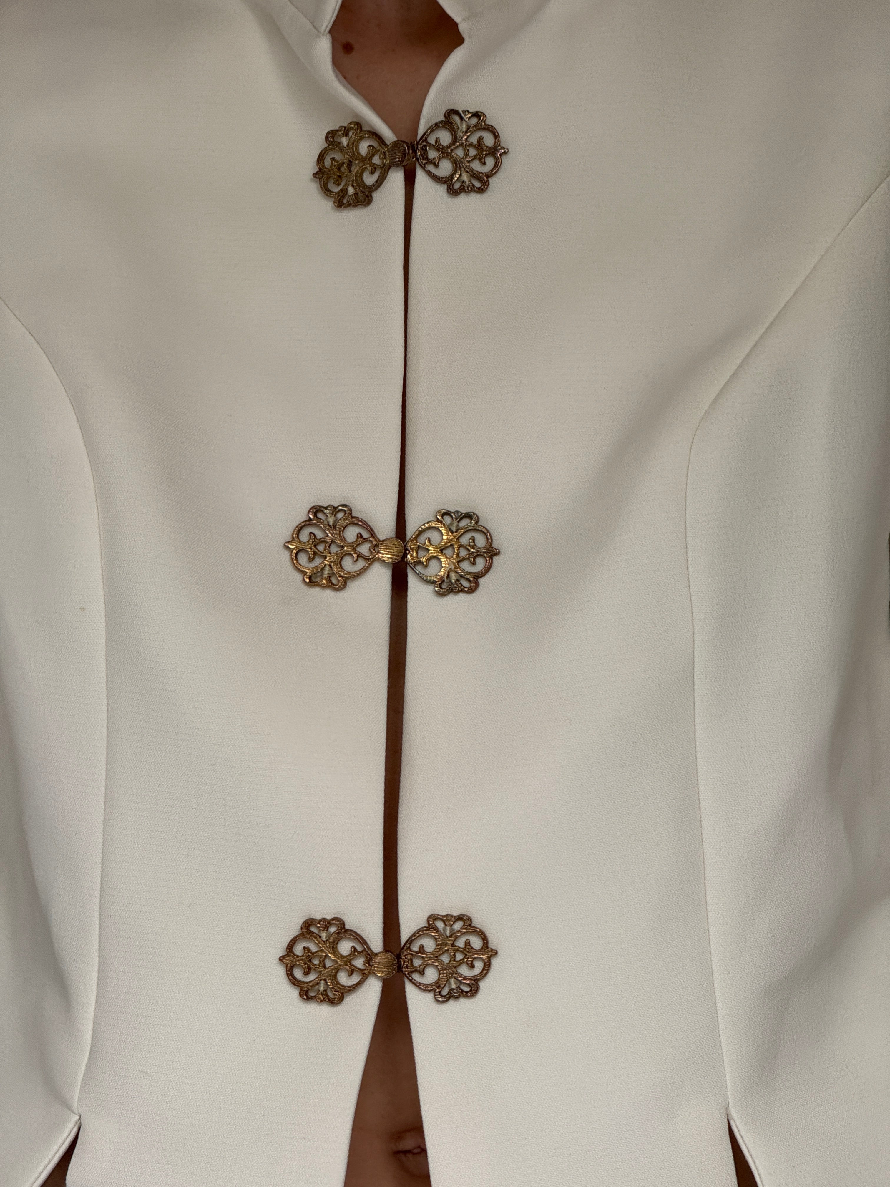 Vintage white jacket gold clasp detail